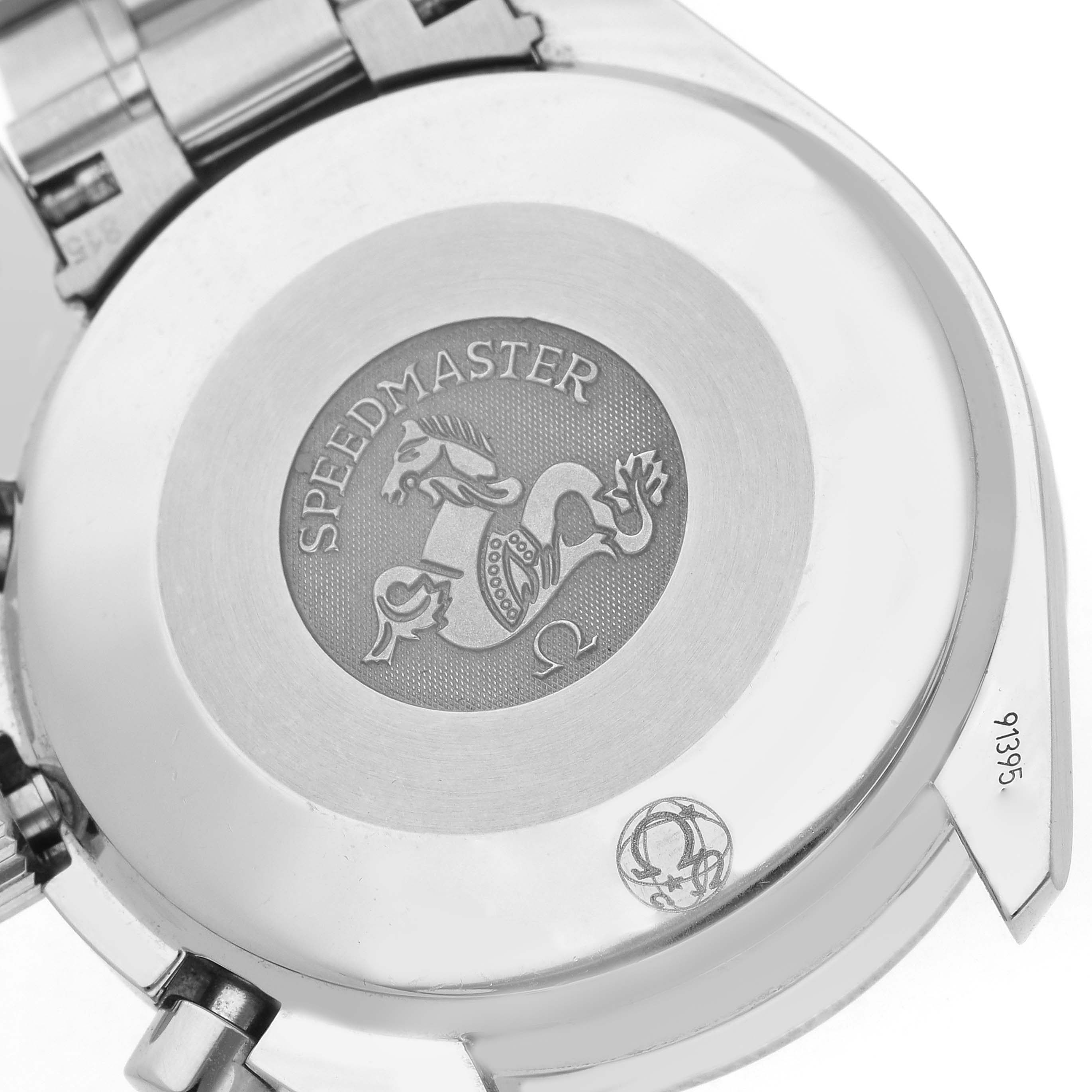 The image shows the case back of an Omega Speedmaster 3539.50.00 Men
s Stainless Steel Black Dial 3539.50.00 Men
s Stainless Steel Black Dial, highlighting the emblem and inscriptions.