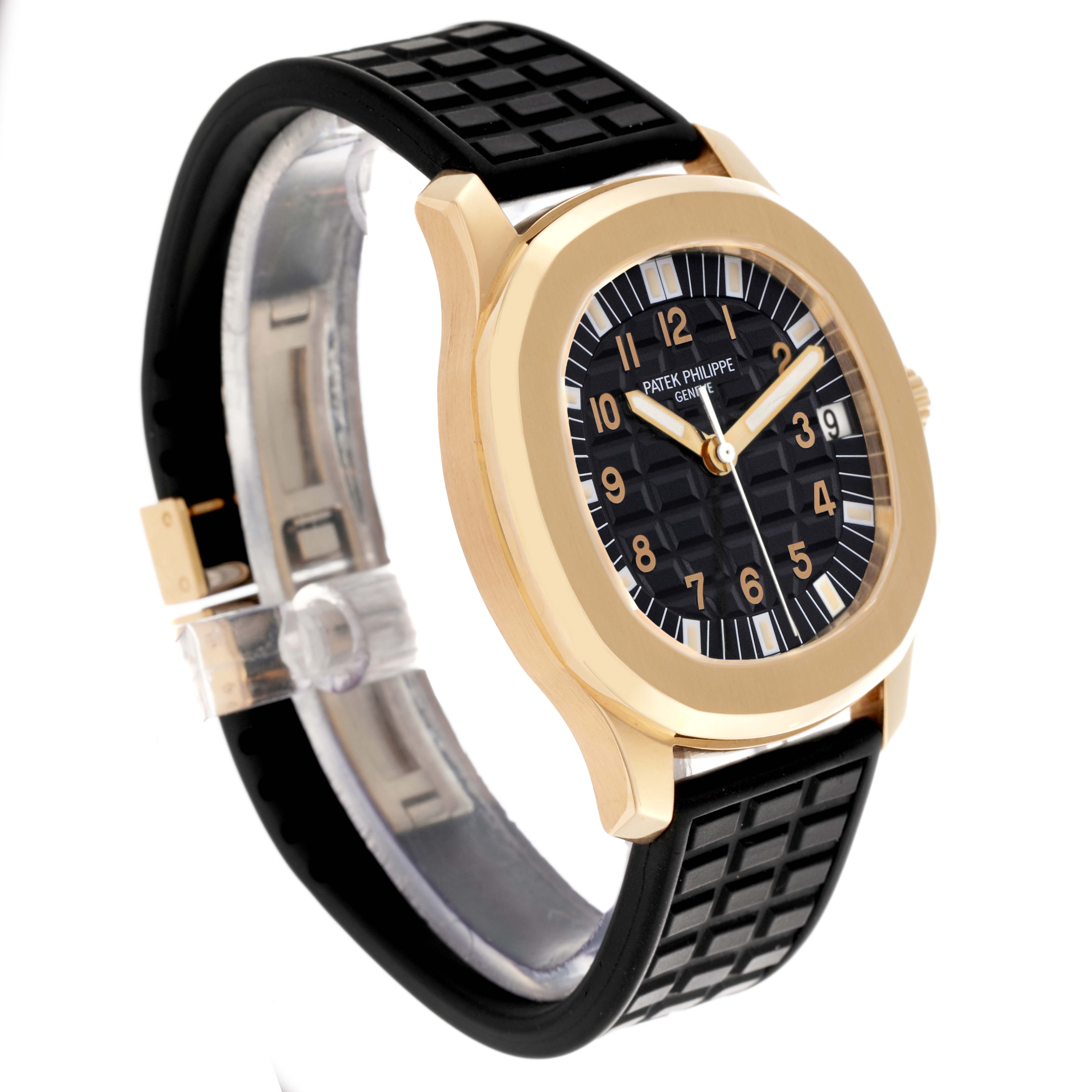 The Patek Philippe Aquanaut 5065J Men's Yellow Gold Black Dial 5065J Men's Yellow Gold Black Dial watch is shown at a three-quarter angle, displaying the face, bezel, crown, and rubber strap.