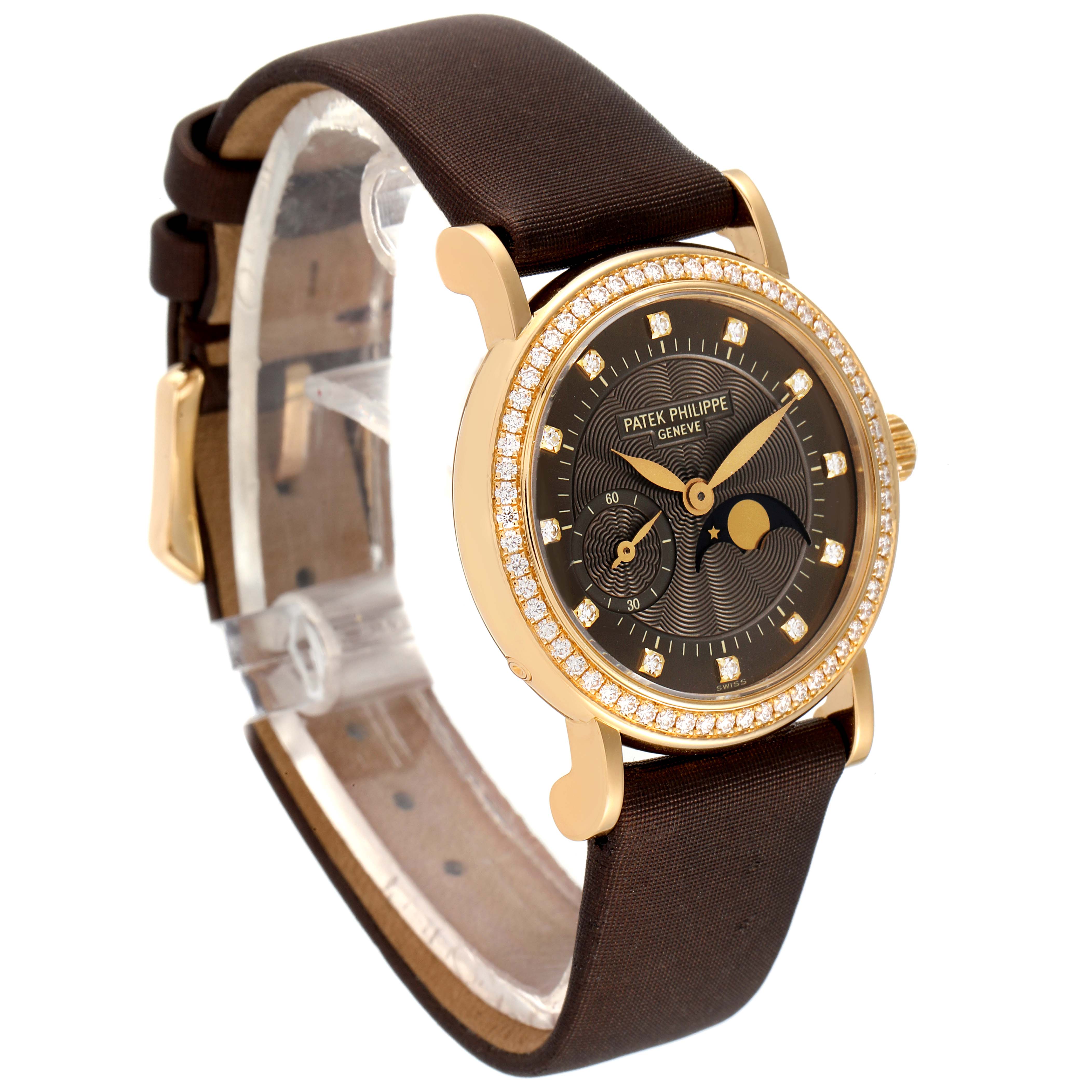 The Patek Philippe Calatrava 4858J-010 Women's Yellow Gold Brown Dial 4858J-010 Women's Yellow Gold Brown Dial watch is shown at a three-quarter angle, displaying the dial, case, and strap in detail.