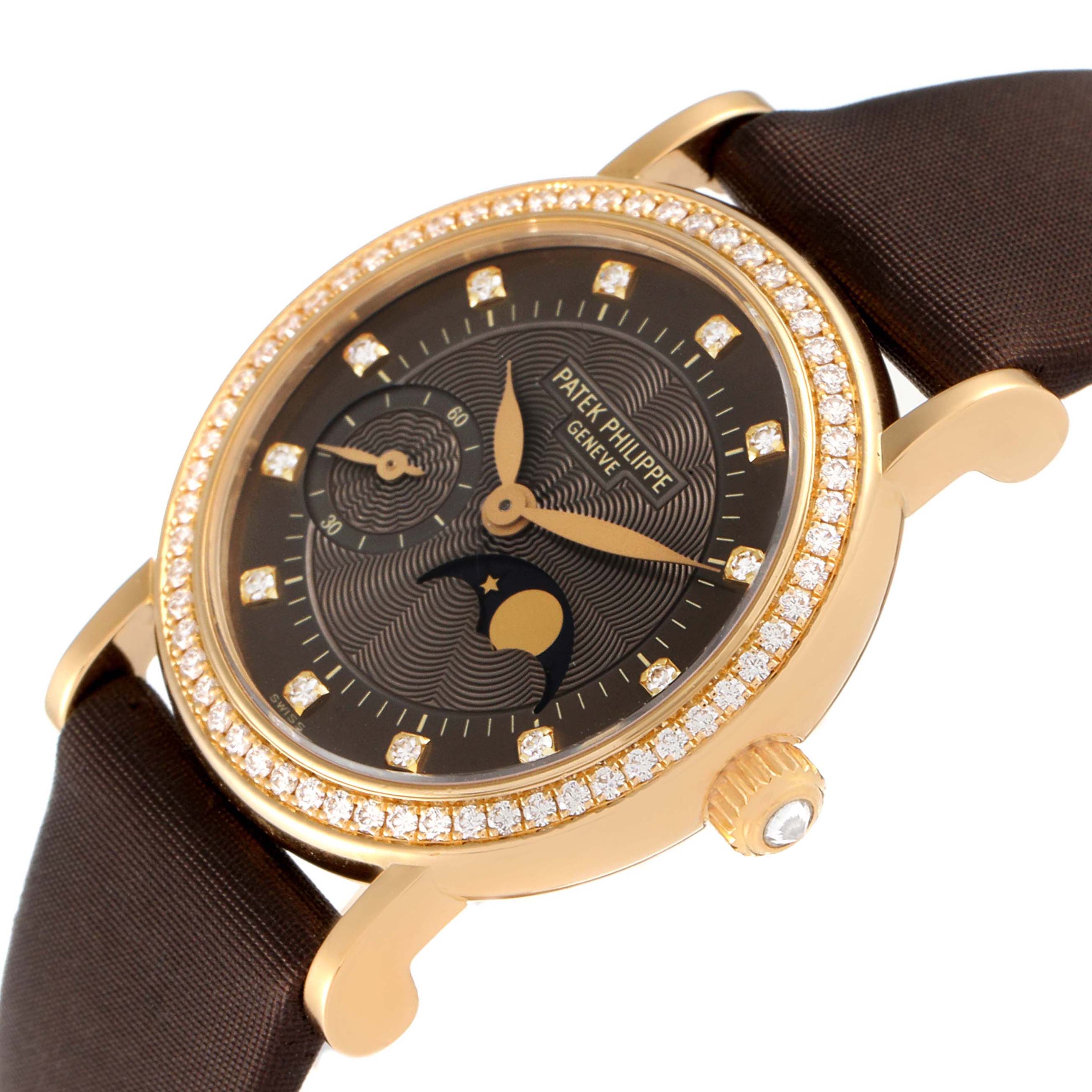 This image shows a Calatrava model by Patek Philippe at an angled view, highlighting the detailed dial and diamond-encrusted bezel.