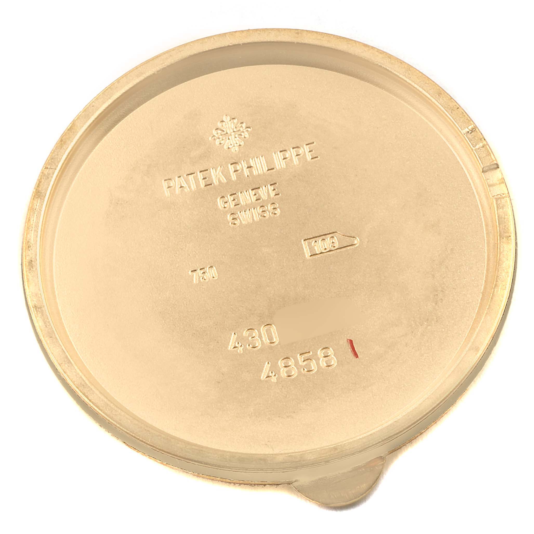 This image shows the inner case back of a Patek Philippe Calatrava 4858J-010 Women's Yellow Gold Brown Dial 4858J-010 Women's Yellow Gold Brown Dial watch, displaying various engravings and hallmarks.