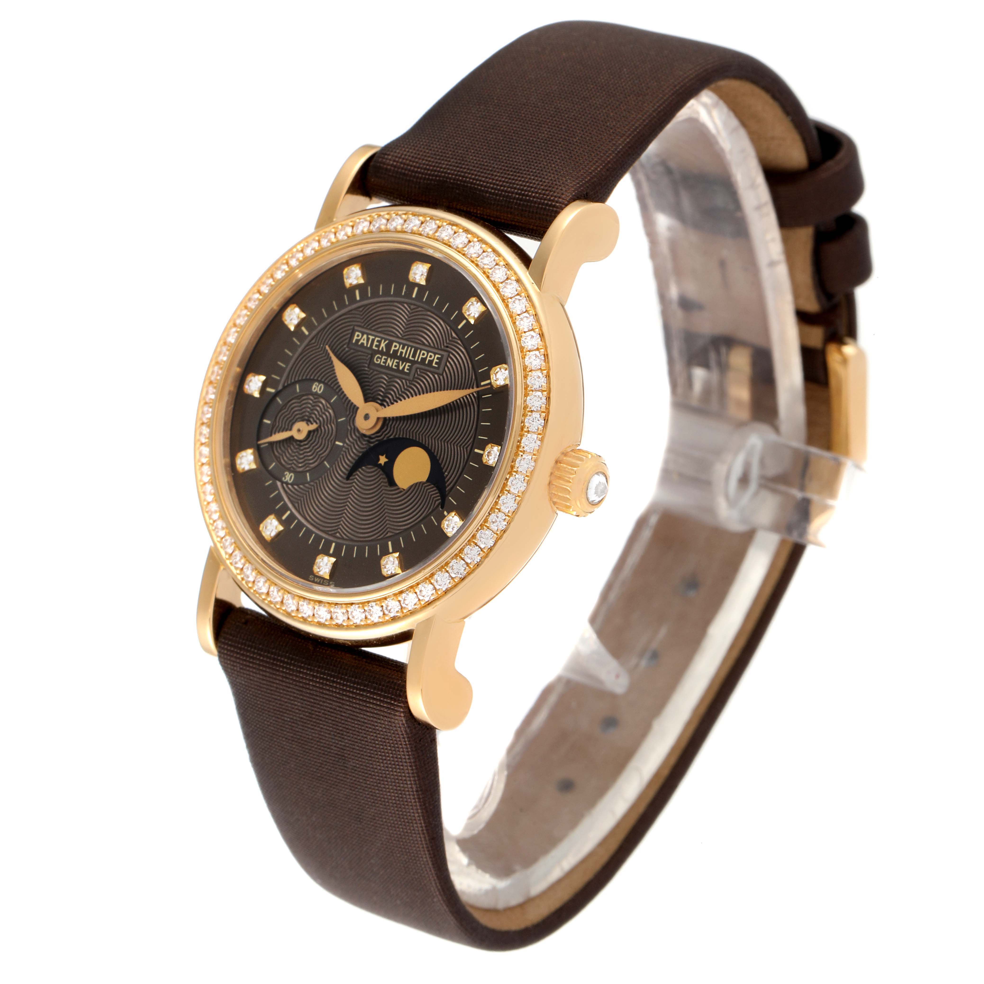 This image shows a Patek Philippe Calatrava 4858J-010 Women's Yellow Gold Brown Dial 4858J-010 Women's Yellow Gold Brown Dial watch at an angled, close-up view highlighting its face, bezel, and strap.