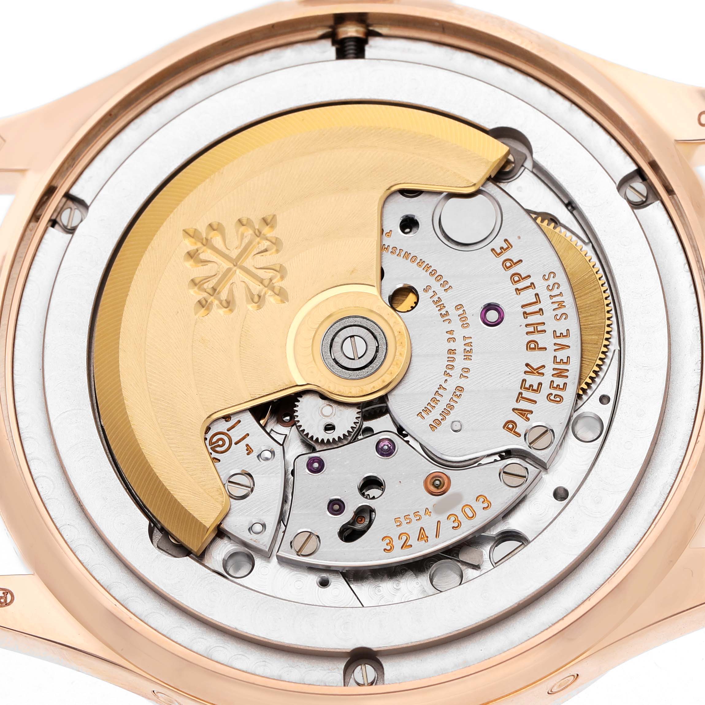 The image shows the back view of a Patek Philippe Complications 5396R-001 Men's Rose Gold Silver Dial watch, highlighting the rotor and movement components.