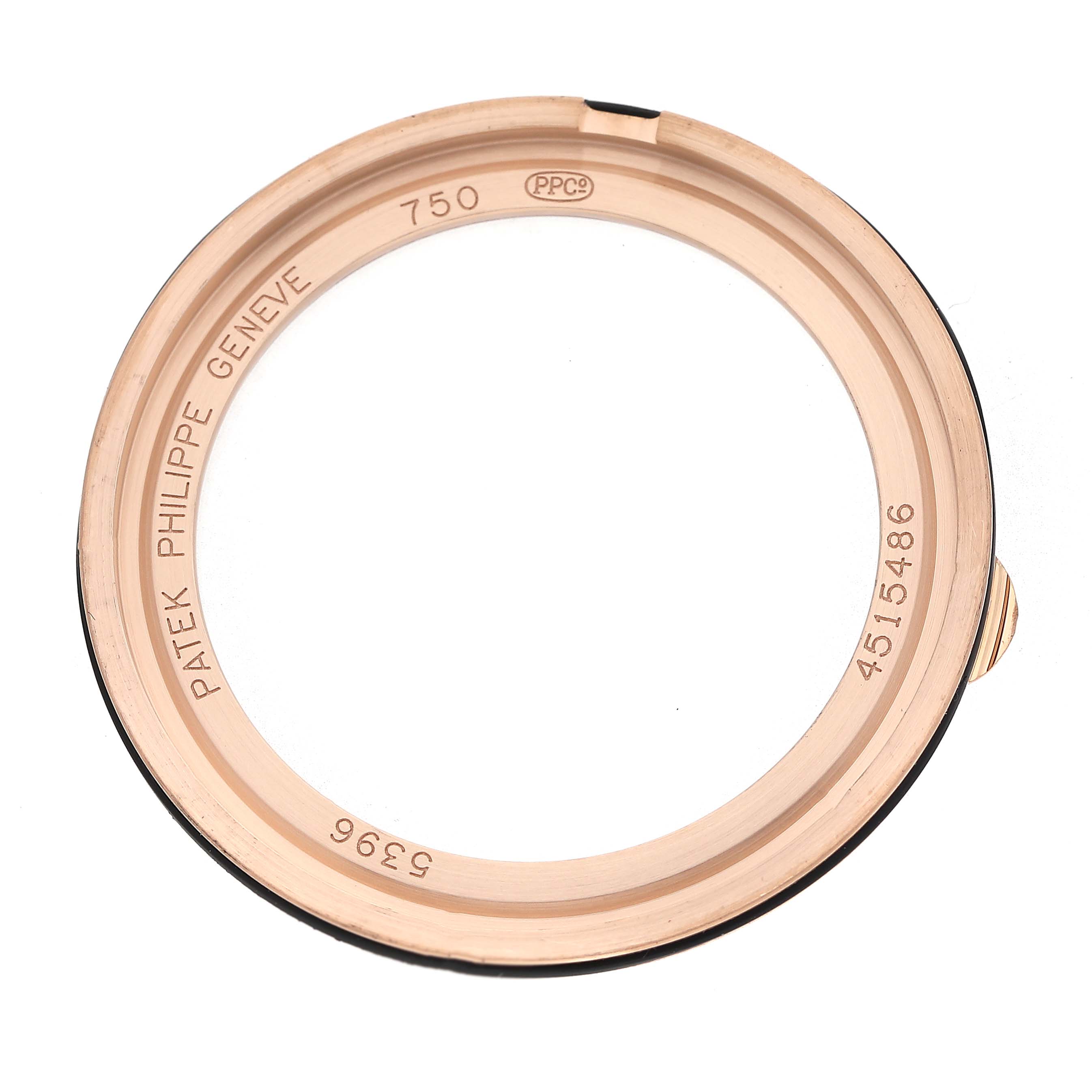 The image shows the bezel of a Patek Philippe Complications 5396R-001 Men's Rose Gold Silver Dial watch from a top view angle.