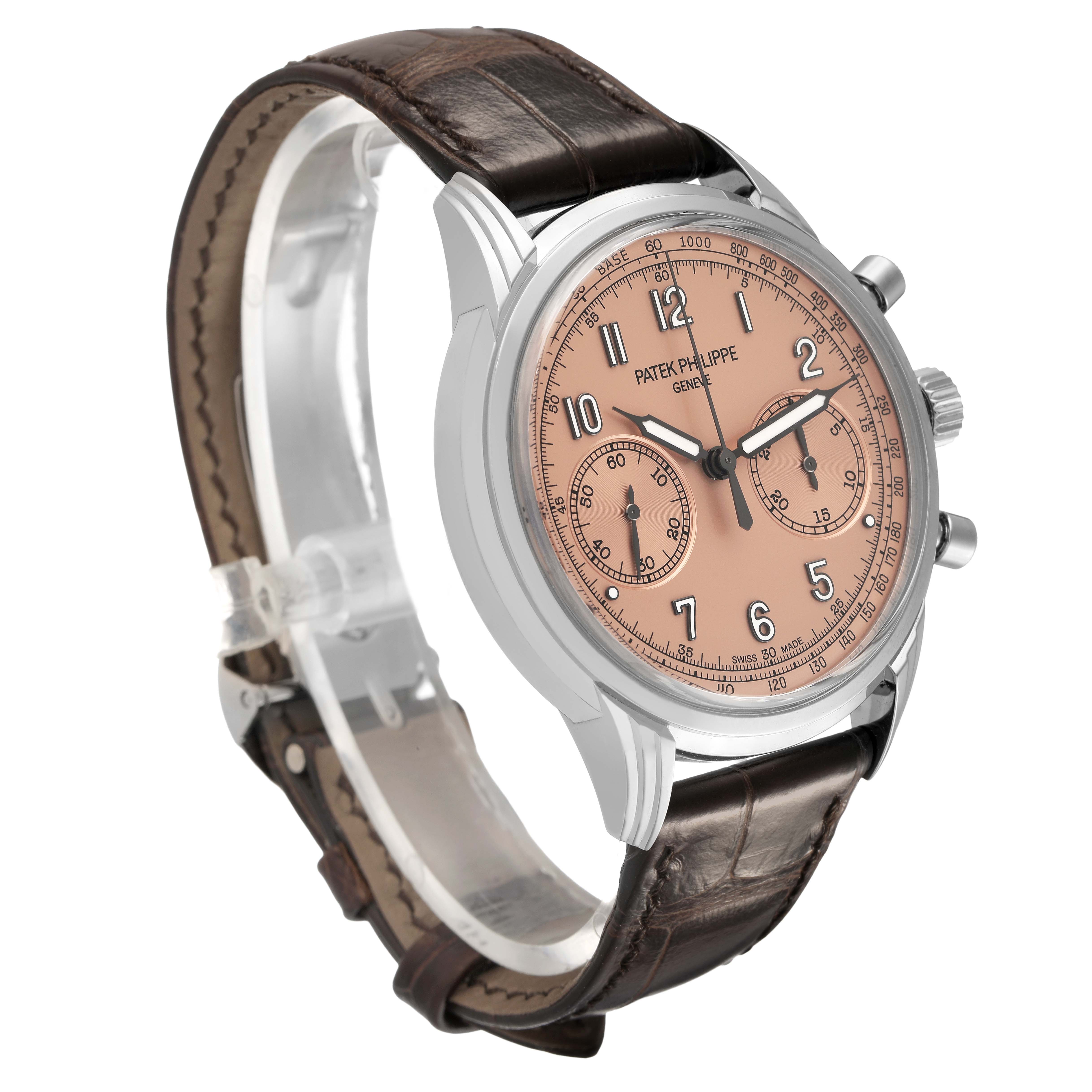 The Patek Philippe Complications 5172G-001 Men's White Gold Pink Dial watch is shown at a three-quarter angle, highlighting the pink dial, subdials, and leather strap.