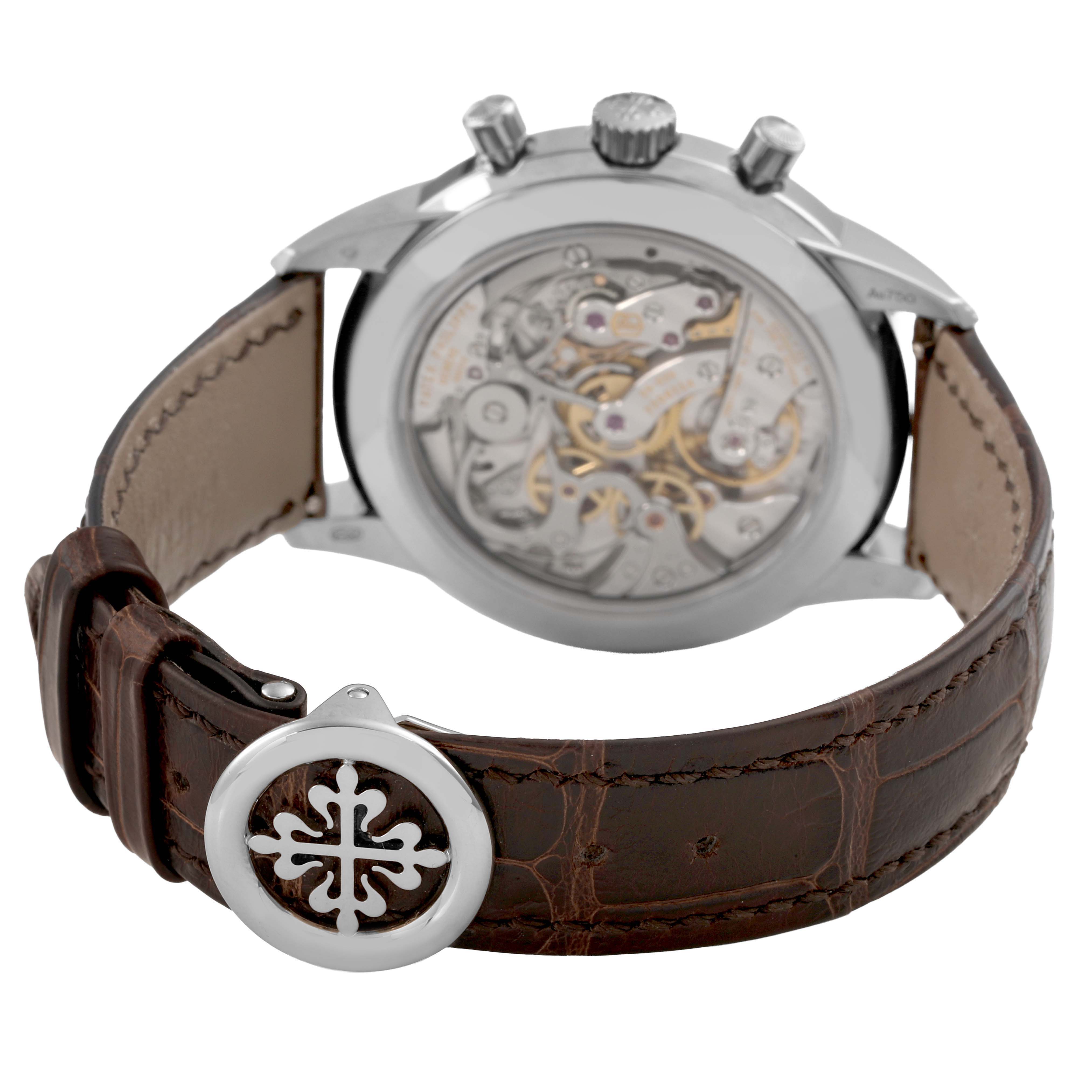 The image shows the back of a Patek Philippe Complications 5172G-001 Men's White Gold Pink Dial watch, highlighting the movement and clasp.