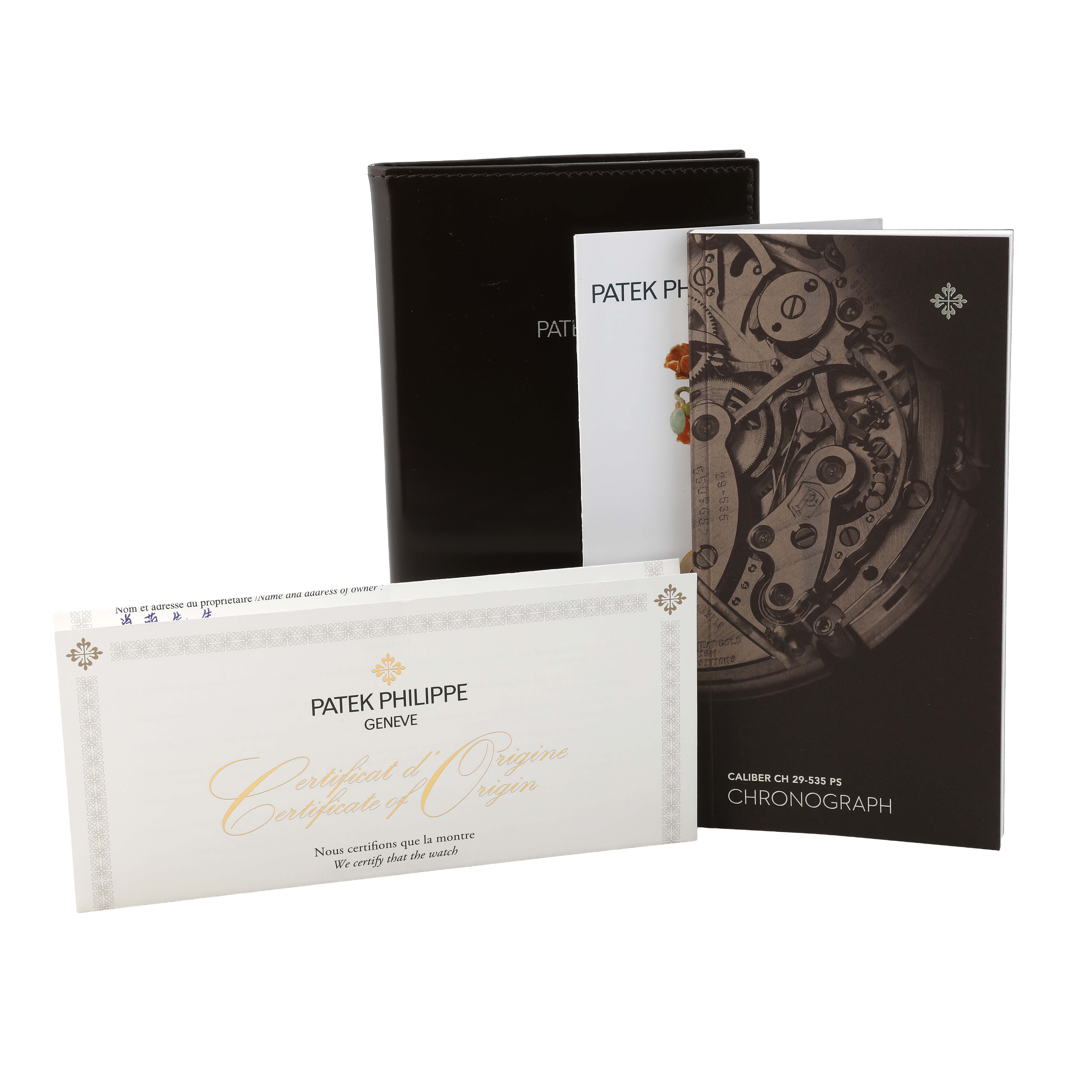 The image shows accessories for a Patek Philippe Complications 5172G-001 Men's White Gold Pink Dial watch, including manuals and a certificate of origin.