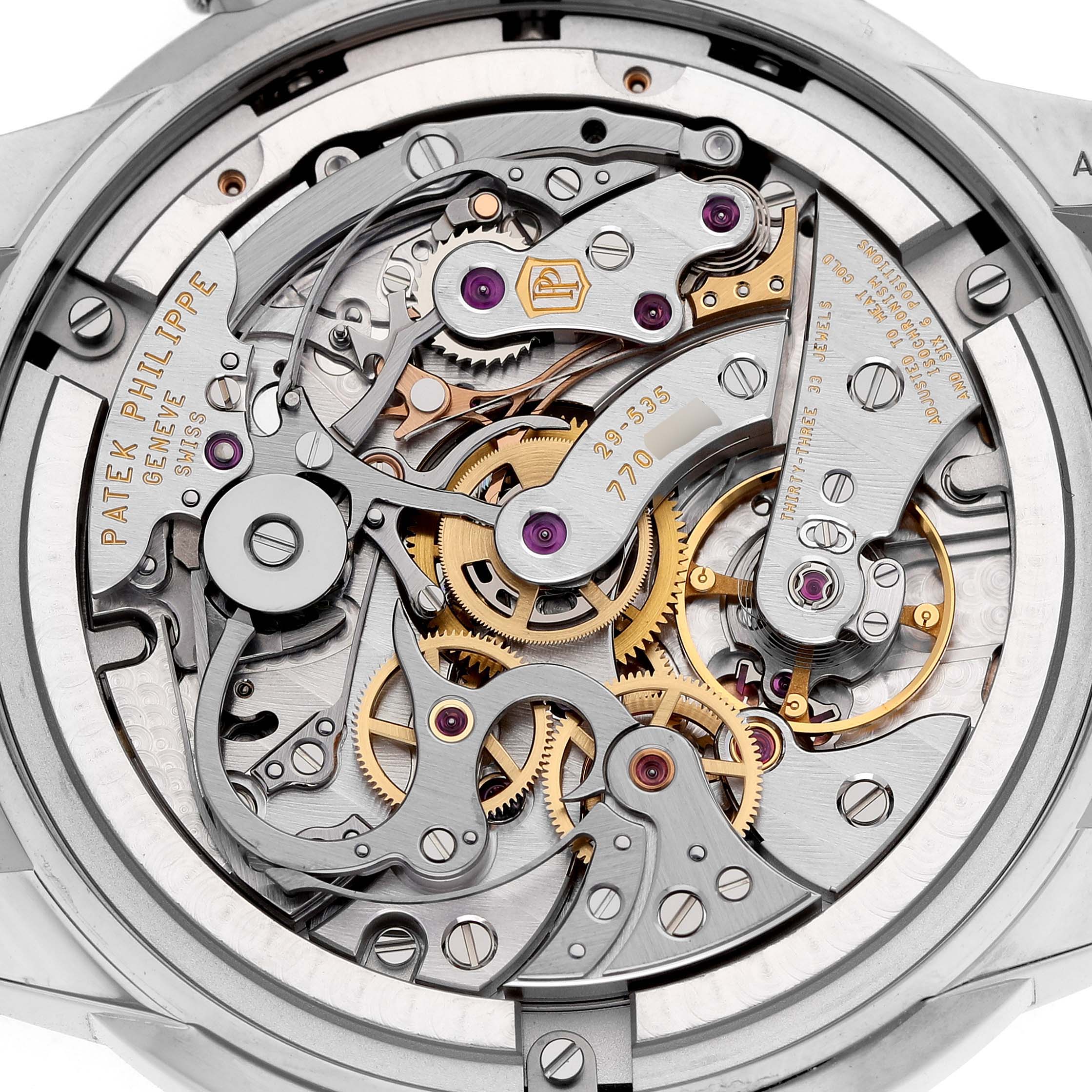 The image shows a close-up of the movement and intricate mechanics of the Patek Philippe Complications 5172G-001 Men's White Gold Pink Dial watch from the back.