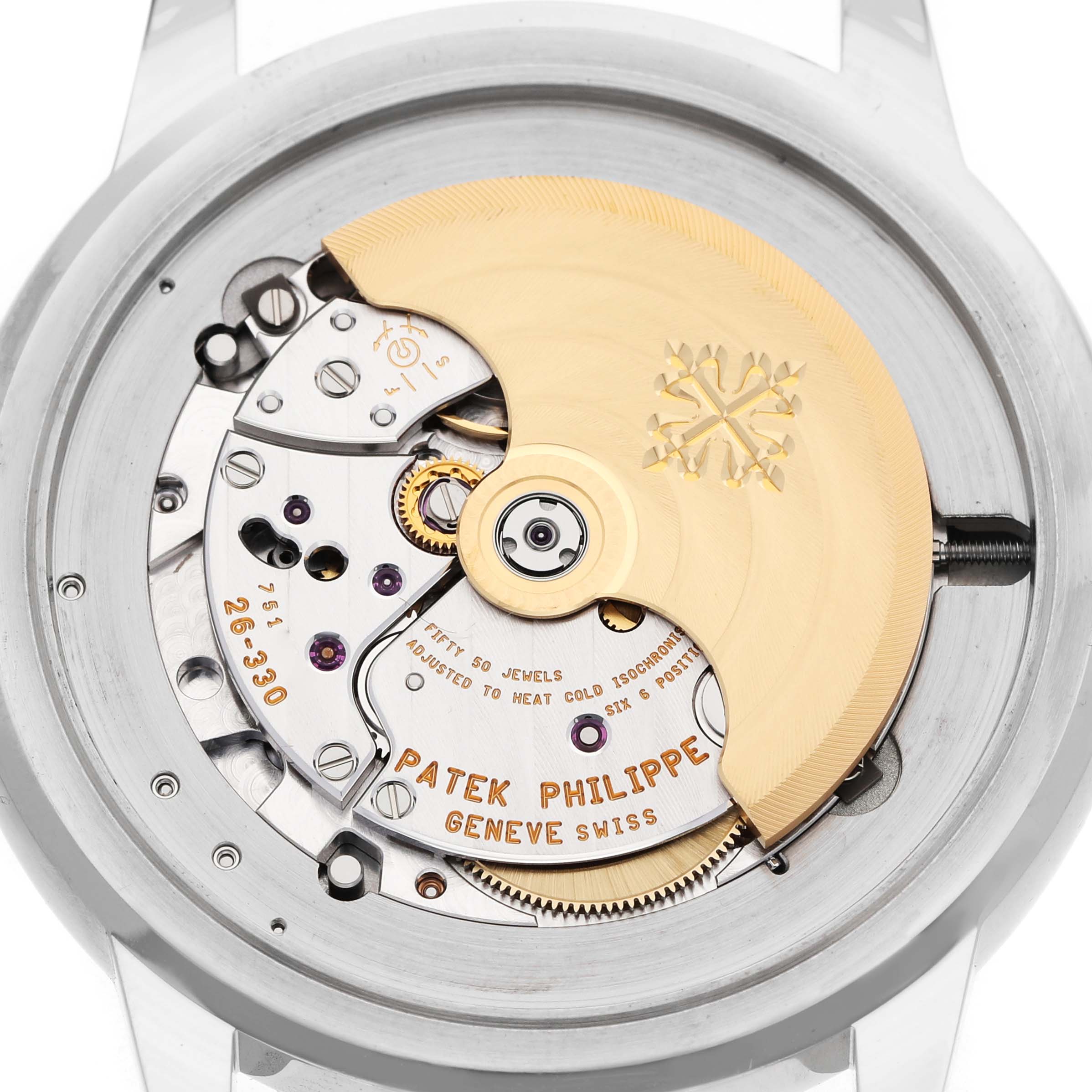 The image shows the back of a Patek Philippe Complications 5212A-001 Men's Stainless Steel Silver Dial watch, highlighting its movement and intricate components.