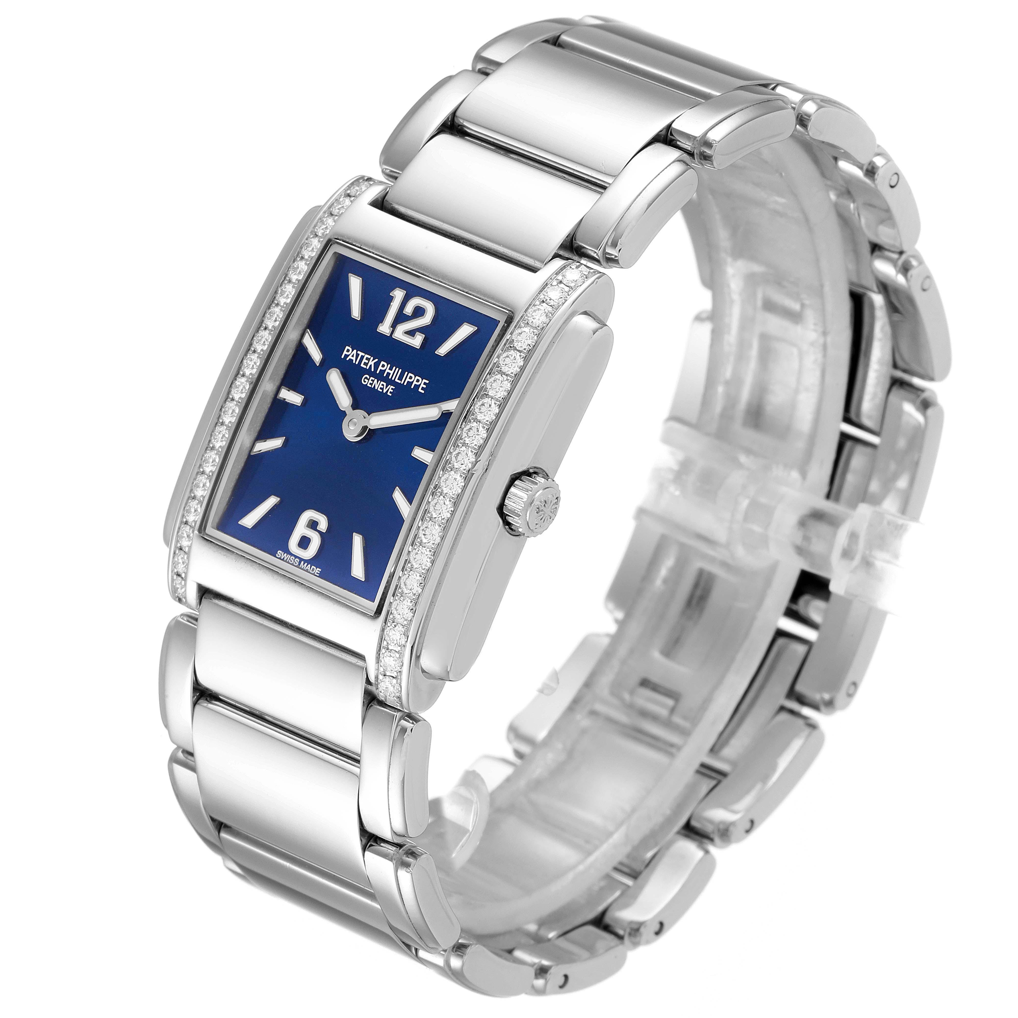 The Patek Philippe Twenty-4 4910/1200A Women's Stainless Steel Blue Dial 4910/1200A Women's Stainless Steel Blue Dial watch is shown from a three-quarter angle, displaying the dial, bracelet, and crown.