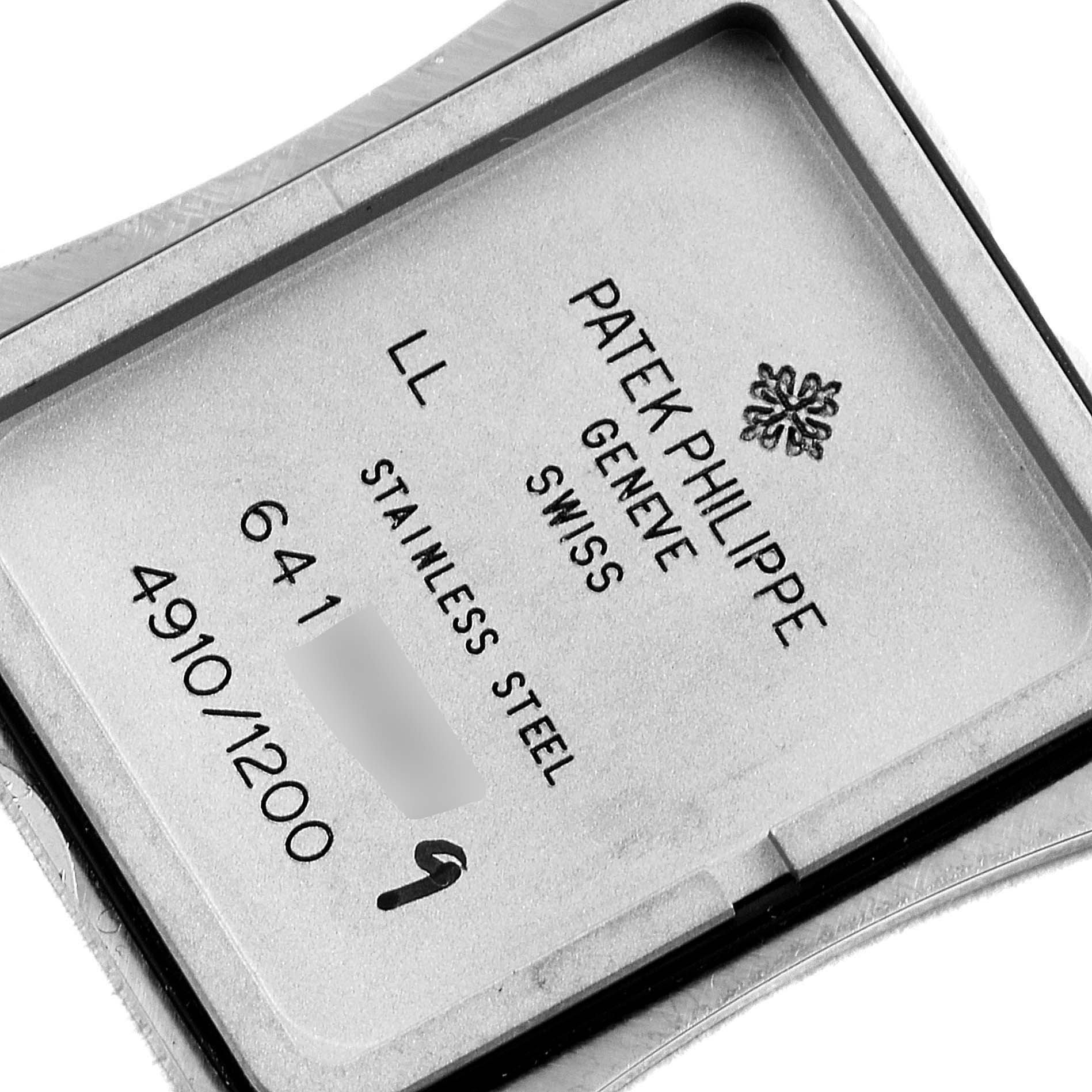 The image shows the back case of the Patek Philippe Twenty-4 4910/1200A Women's Stainless Steel Blue Dial 4910/1200A Women's Stainless Steel Blue Dial watch, displaying the brand details and model specifications.