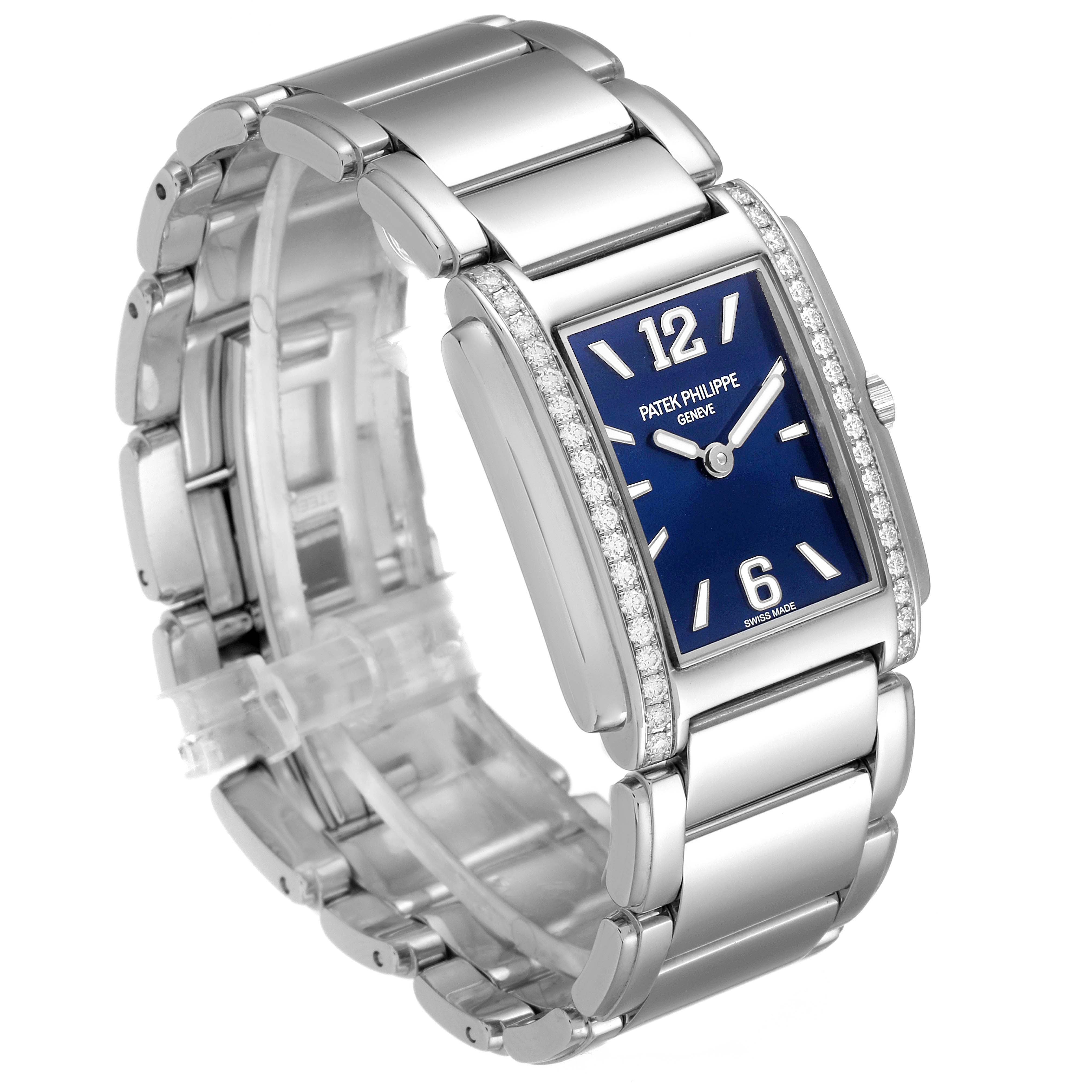 The image shows a Patek Philippe Twenty-4 4910/1200A Women's Stainless Steel Blue Dial 4910/1200A Women's Stainless Steel Blue Dial watch from a three-quarter front angle, highlighting its blue dial and metal bracelet.