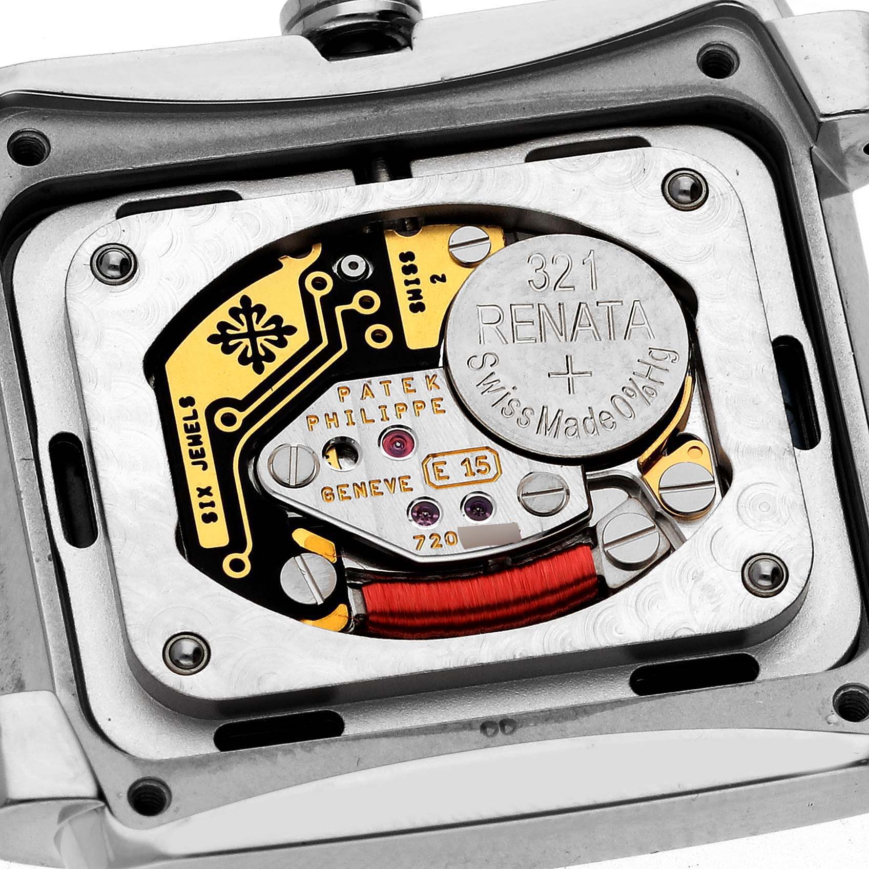 This image shows the rectangular back view of the inner mechanism of the Patek Philippe Twenty-4 4910/10A-012 Women's Stainless Steel Blue Dial 4910/10A-012 Women's Stainless Steel Blue Dial watch, focusing on the movement and battery.