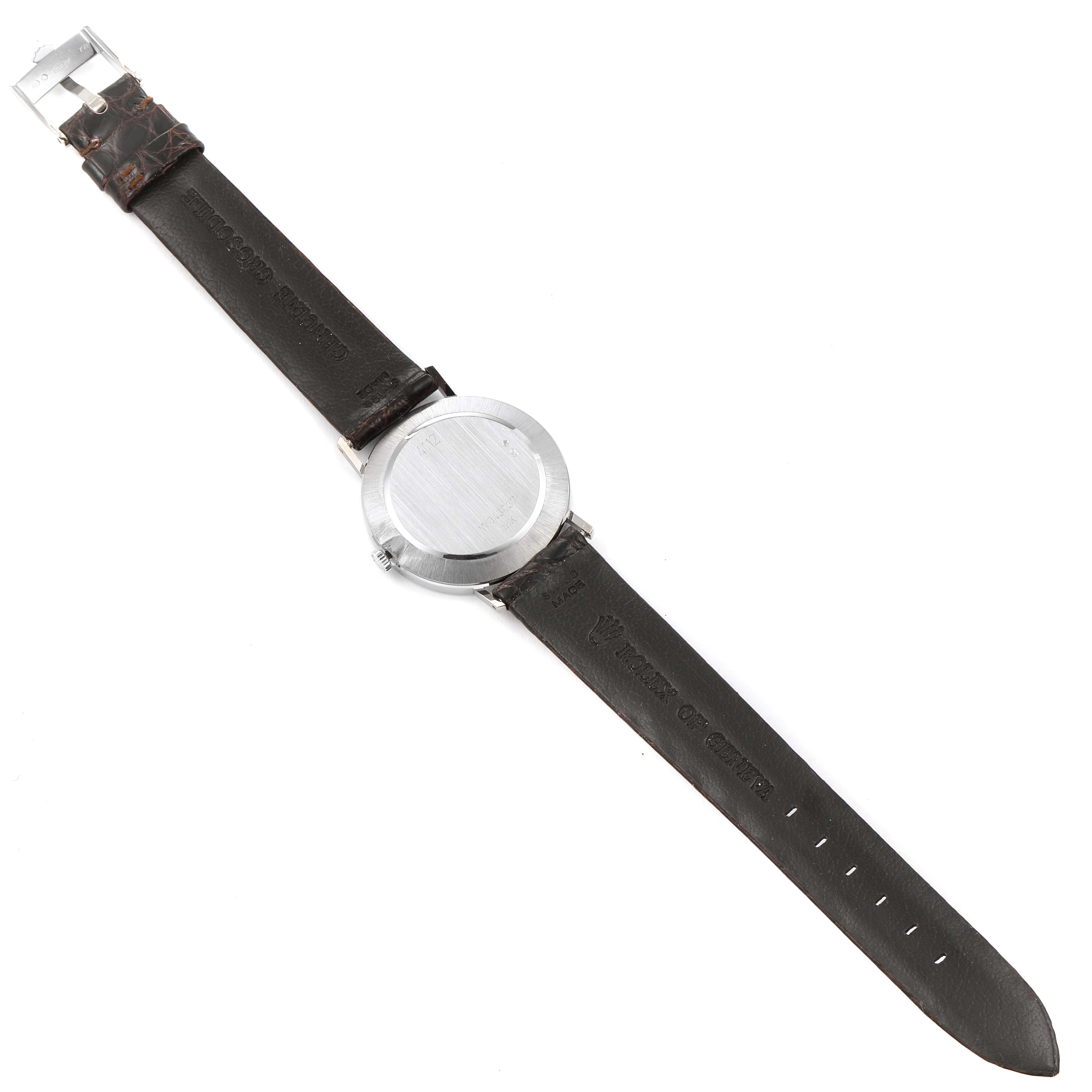 The image shows the back and leather straps of a Rolex Cellini 4112 Men's White Gold Silver Dial 4112 Men's White Gold Silver Dial model watch laid flat, viewed directly from above.