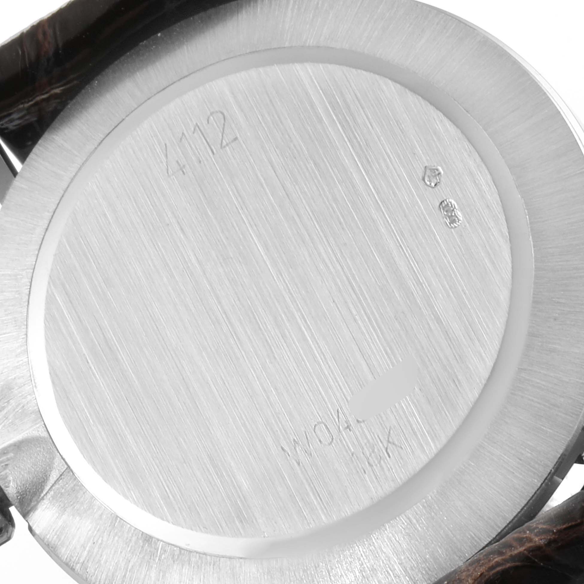 The image shows the back cover of a Rolex Cellini 4112 Men's White Gold Silver Dial 4112 Men's White Gold Silver Dial watch, displaying its brushed metal finish and engraved markings.