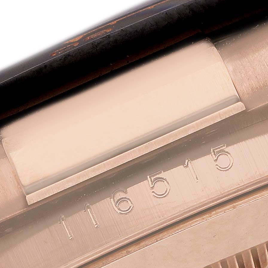 The image shows a close-up angle of the case detailing on a Rolex Daytona 116515 Men's Rose Gold Grey Dial, highlighting the model number engraving.