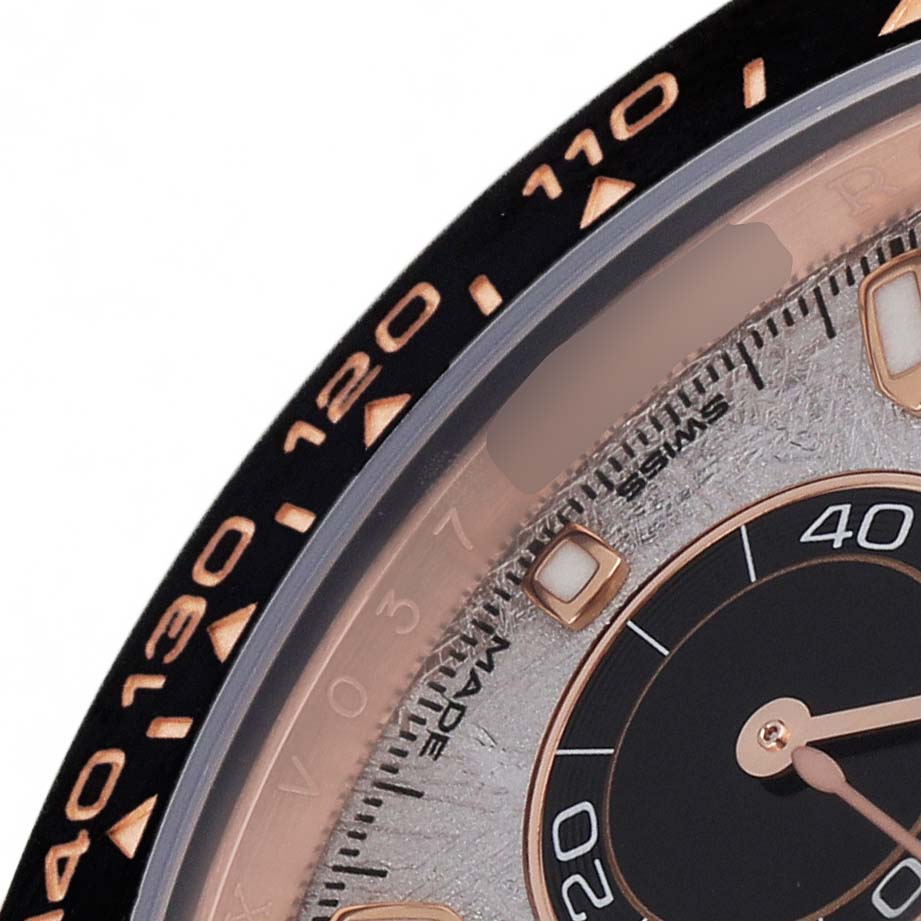 The image shows a close-up of the bezel and sub-dial of a Rolex Daytona 116515 Men's Rose Gold Grey Dial watch at an angle.