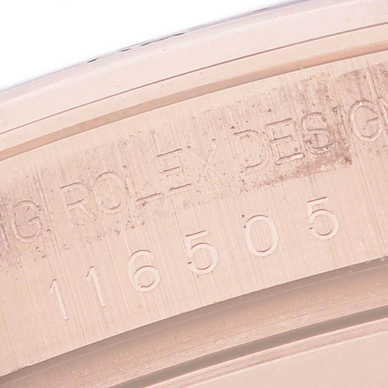 The image shows a close-up of the case engraving on a Rolex Daytona 116505 Men
s Rose Gold Pink Dial 116505 Men
s Rose Gold Pink Dial, indicating the model number.