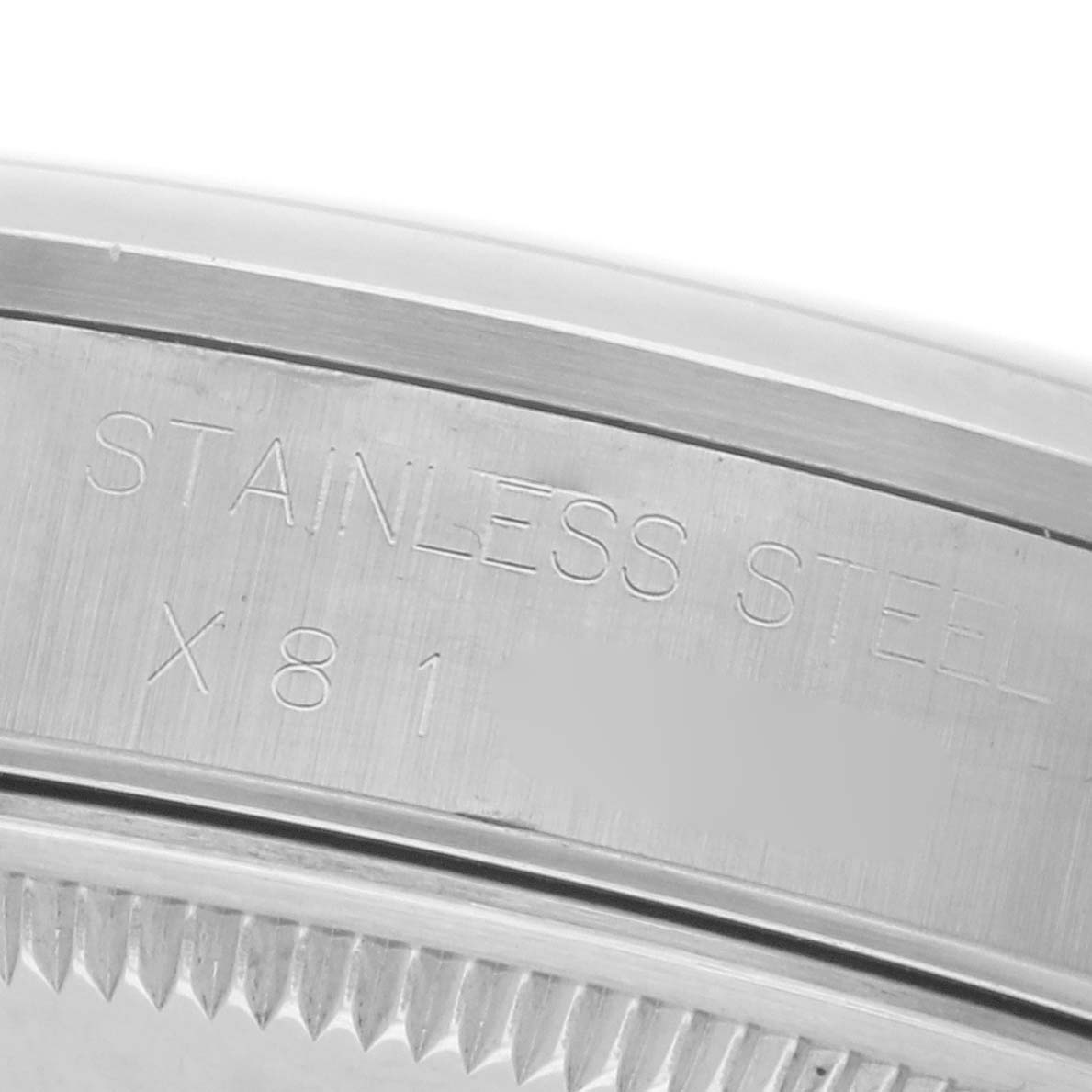 The image shows a close-up of the side of a Rolex Date 15200 Men's Stainless Steel Black Dial 15200 Men's Stainless Steel Black Dial model watch, highlighting the stainless steel engraving and bezel.