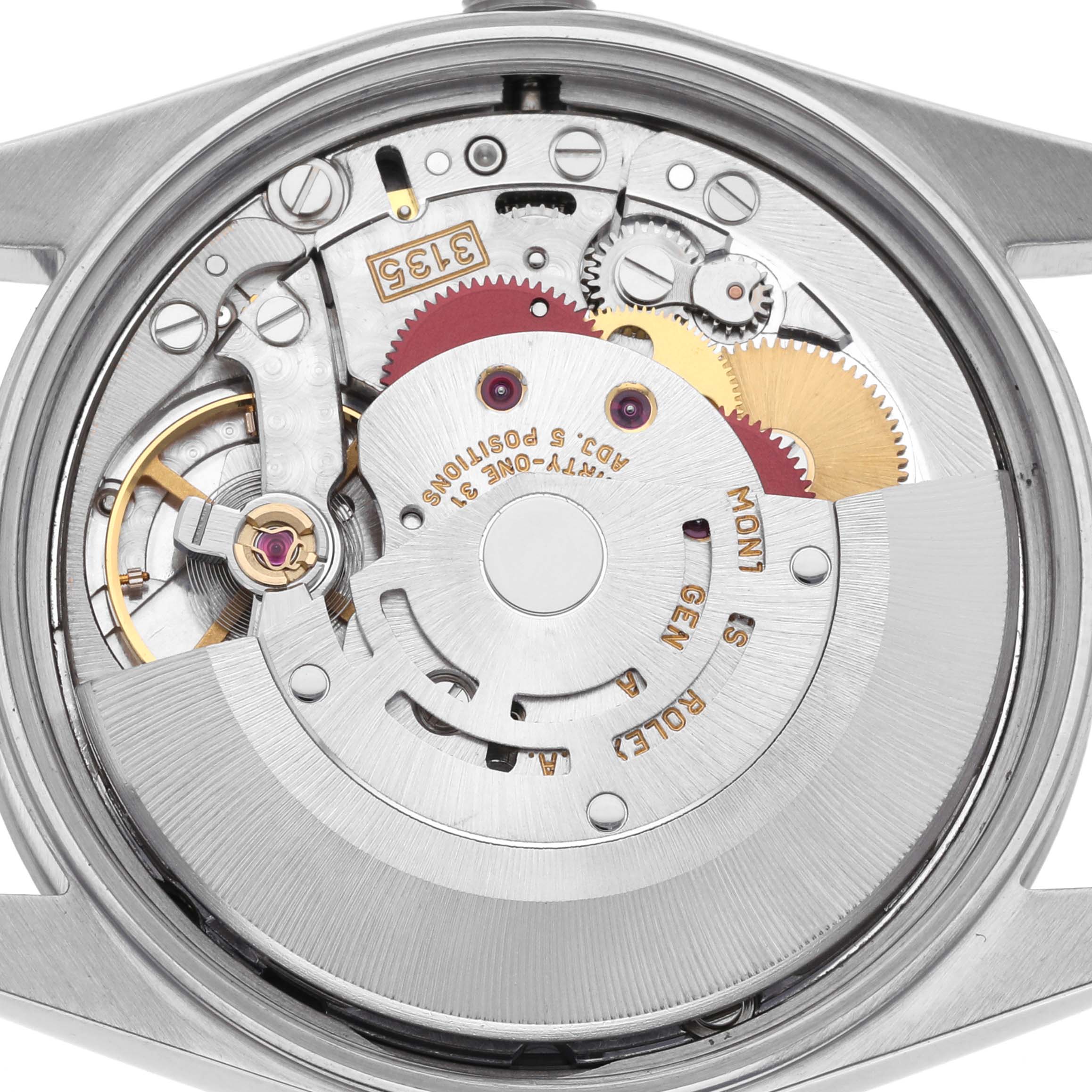 The image shows the movement of a Rolex Date 15200 Men's Stainless Steel Black Dial 15200 Men's Stainless Steel Black Dial watch from the back, highlighting gears, cogs, and the rotor.