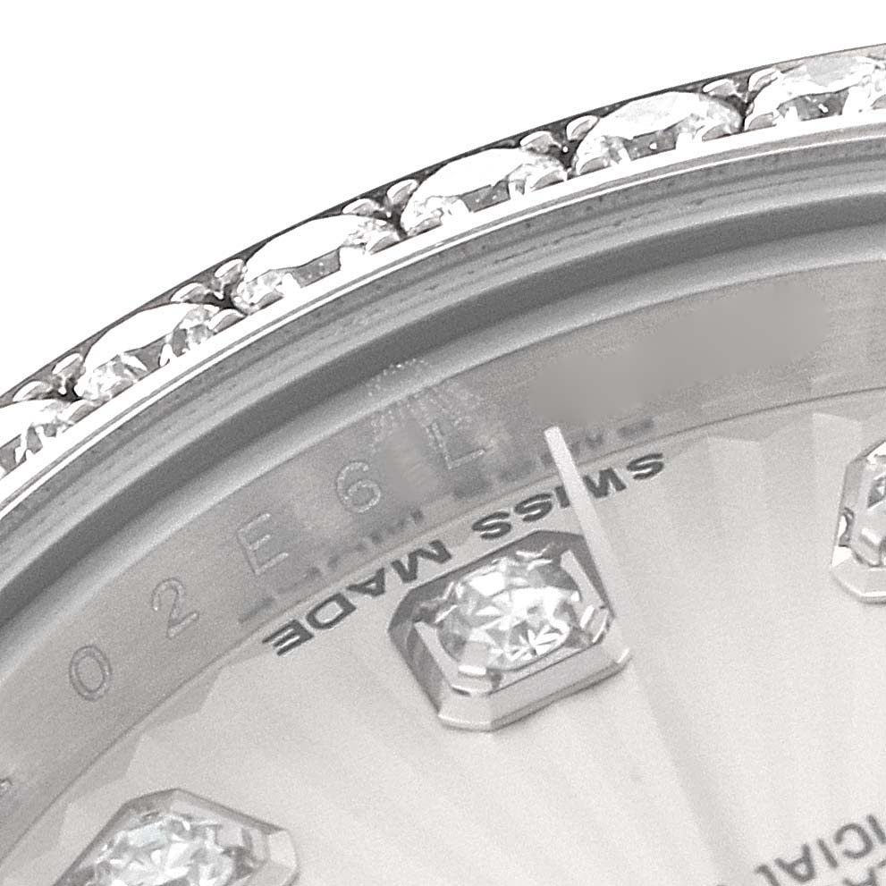 This image shows a close-up of a Rolex Datejust 179384 Women's Stainless Steel Silver Dial 179384 Women's Stainless Steel Silver Dial watch's diamond-studded bezel, markers, and part of the dial with "Swiss Made" text visible.