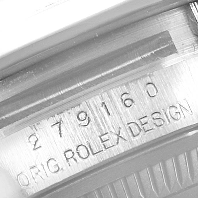 The image shows a close-up of the serial number and design engraving on the case of a Rolex Datejust 279160 Women's Stainless Steel Grey Dial 279160 Women's Stainless Steel Grey Dial watch.