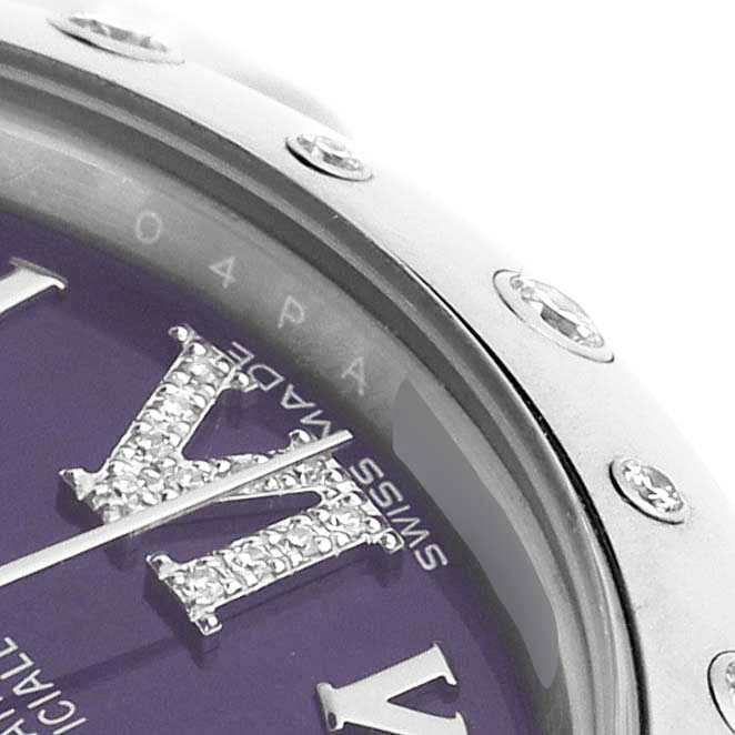 This close-up image of the Rolex Mid-Size 178344 Women's Stainless Steel Purple Dial watch shows part of the bezel with diamond elements and the watch face featuring a 'VI' numeral.