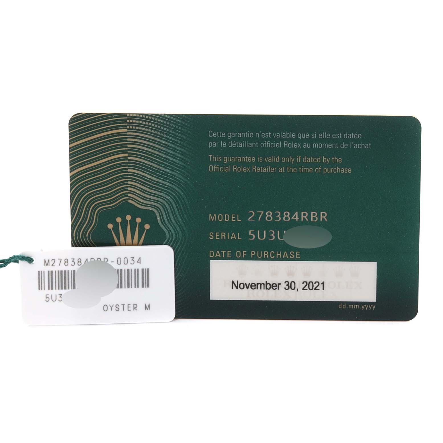 The image shows the warranty card and tag accessories for a Mid-Size Rolex, model 278384RBR.