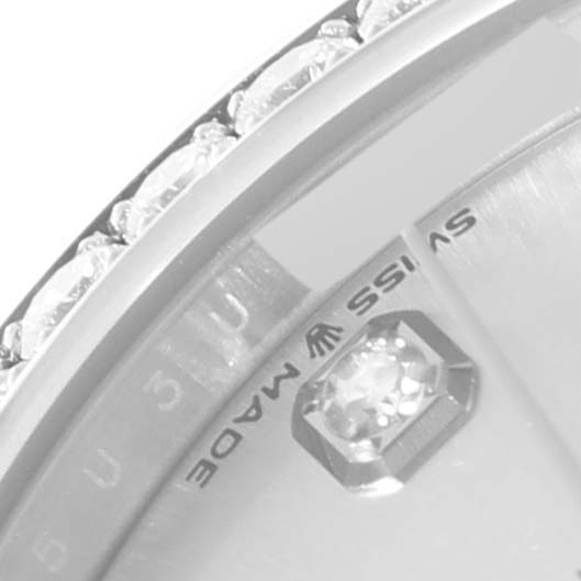 This close-up shows the bezel and part of the dial with diamonds of a Rolex Mid-Size 278384RBR Women
s Stainless Steel Silver Dial 278384RBR Women
s Stainless Steel Silver Dial model watch.