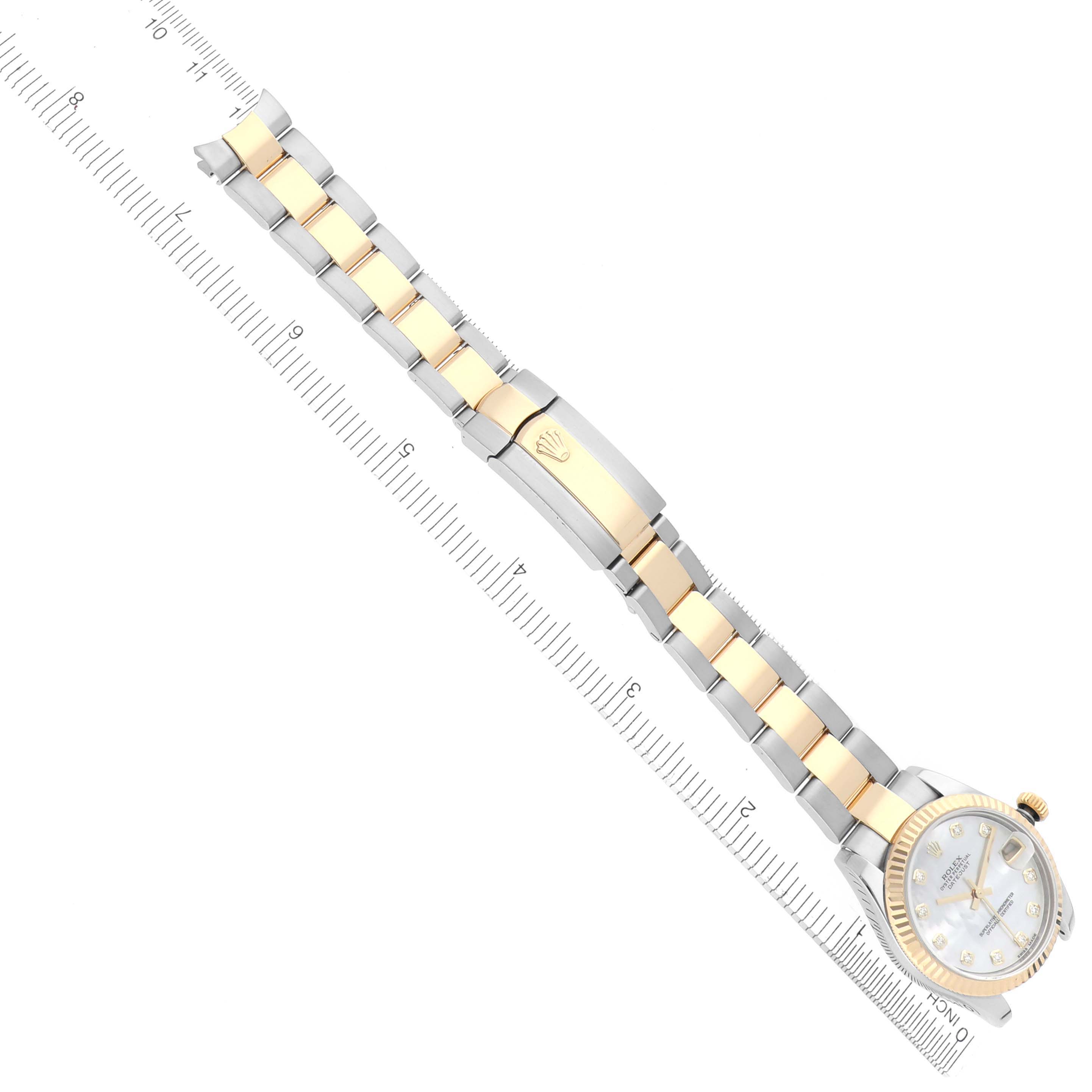 The Rolex Mid-Size 178273 Women's Steel and Gold (two tone) Mother of Pearl Dial 178273 Women's Steel and Gold (two tone) Mother of Pearl Dial watch is shown from a top view, highlighting the bracelet, watch face, and clasp.