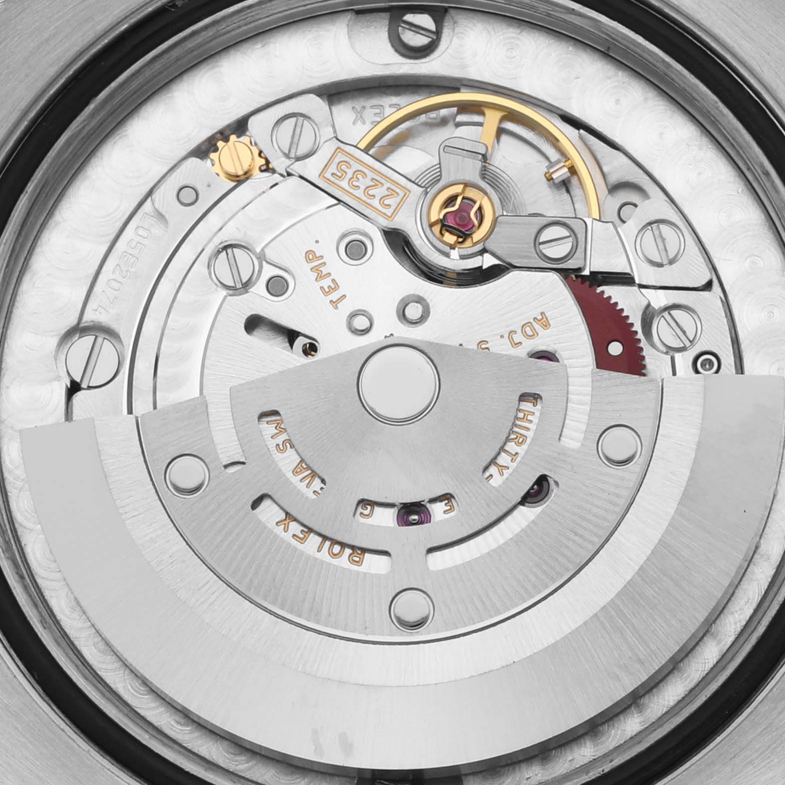 The image shows the intricate movement and rotor of a Rolex Mid-Size 178273 Women's Steel and Gold (two tone) Mother of Pearl Dial 178273 Women's Steel and Gold (two tone) Mother of Pearl Dial model from a rear angle.