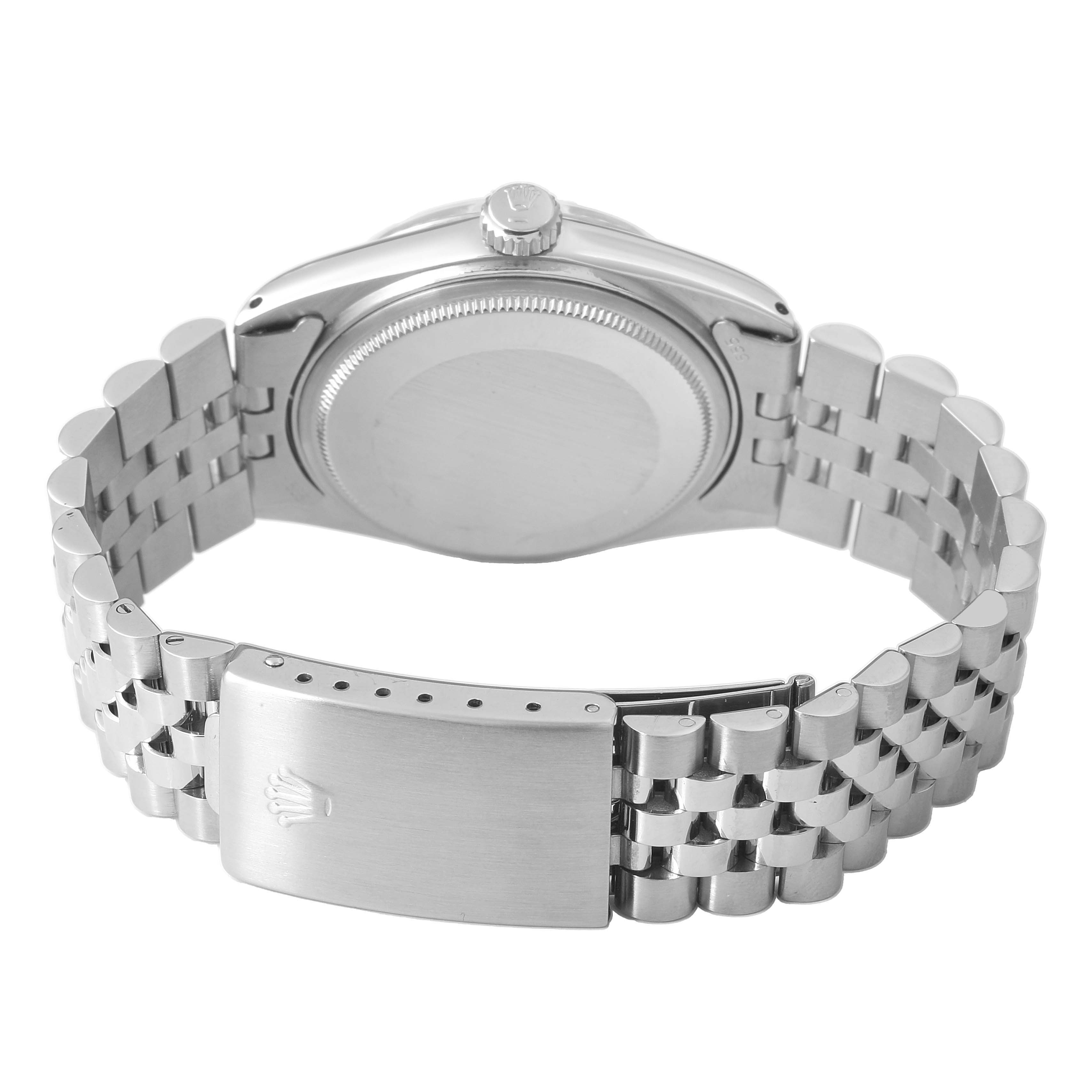 The image shows the back of the case and bracelet clasp of a Rolex Vintage Collection 16014 Men's Stainless Steel Silver Dial watch.