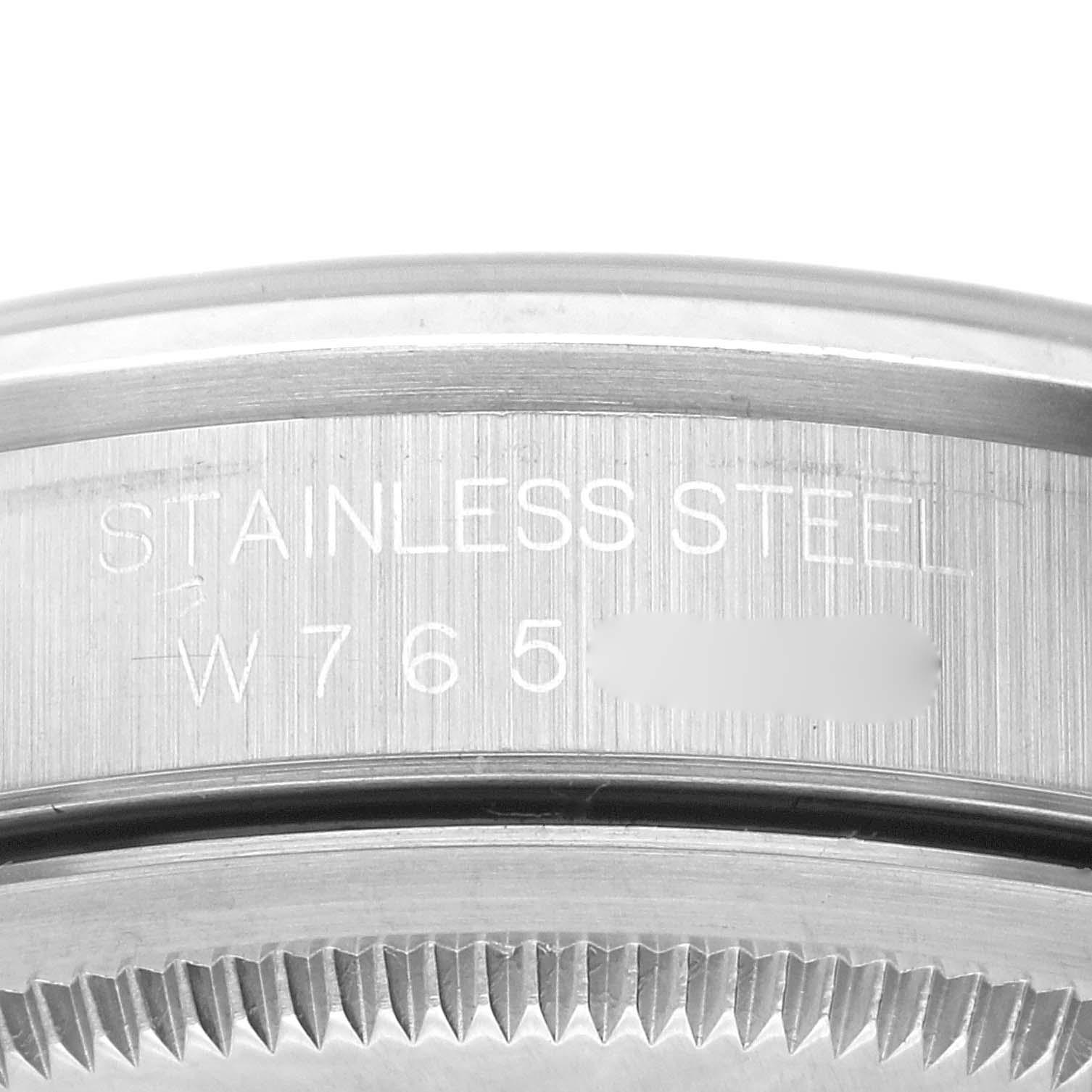 This image shows a close-up of the stainless steel case back engraving on a Rolex Datejust 16200 Men's Stainless Steel Blue Dial 16200 Men's Stainless Steel Blue Dial model.