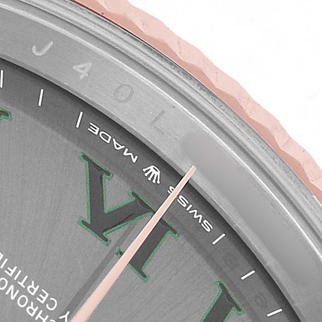 The image shows a close-up of the Rolex Datejust 41 126331 Men's Steel and Gold (two tone) Grey Dial watch's dial, focusing on the Roman numeral VI and the "Swiss Made" text.