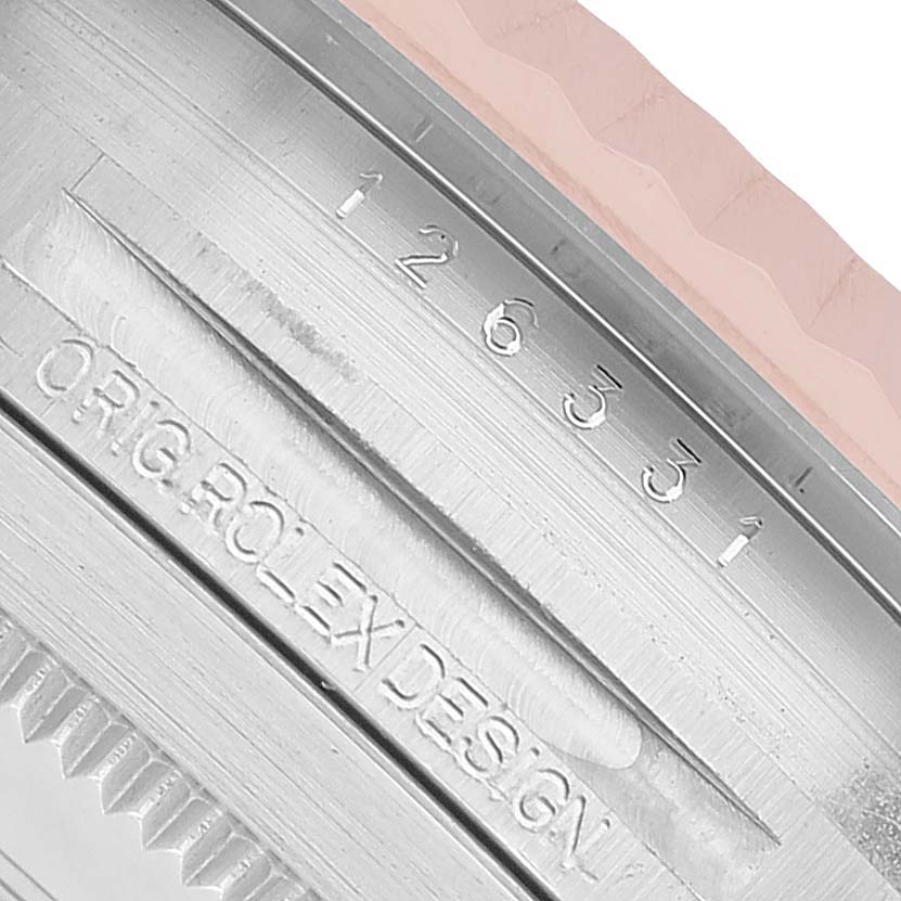 The image shows a close-up of the Rolex Datejust 41 126331 Men's Steel and Gold (two tone) Grey Dial watch case with engraving details.