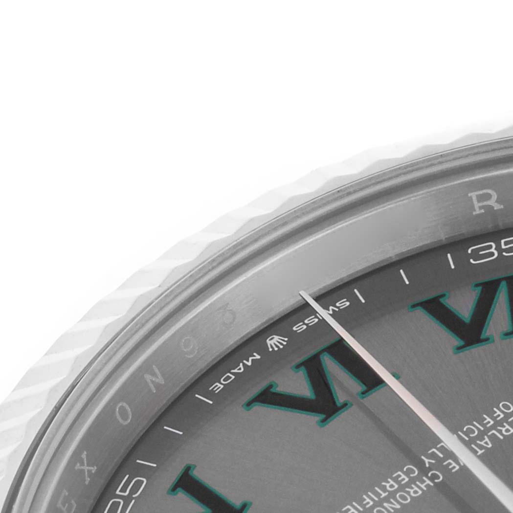 The image shows a close-up of the bezel, dial, and minute hand of a Rolex Datejust 41 126334 Men's Stainless Steel Grey Dial.