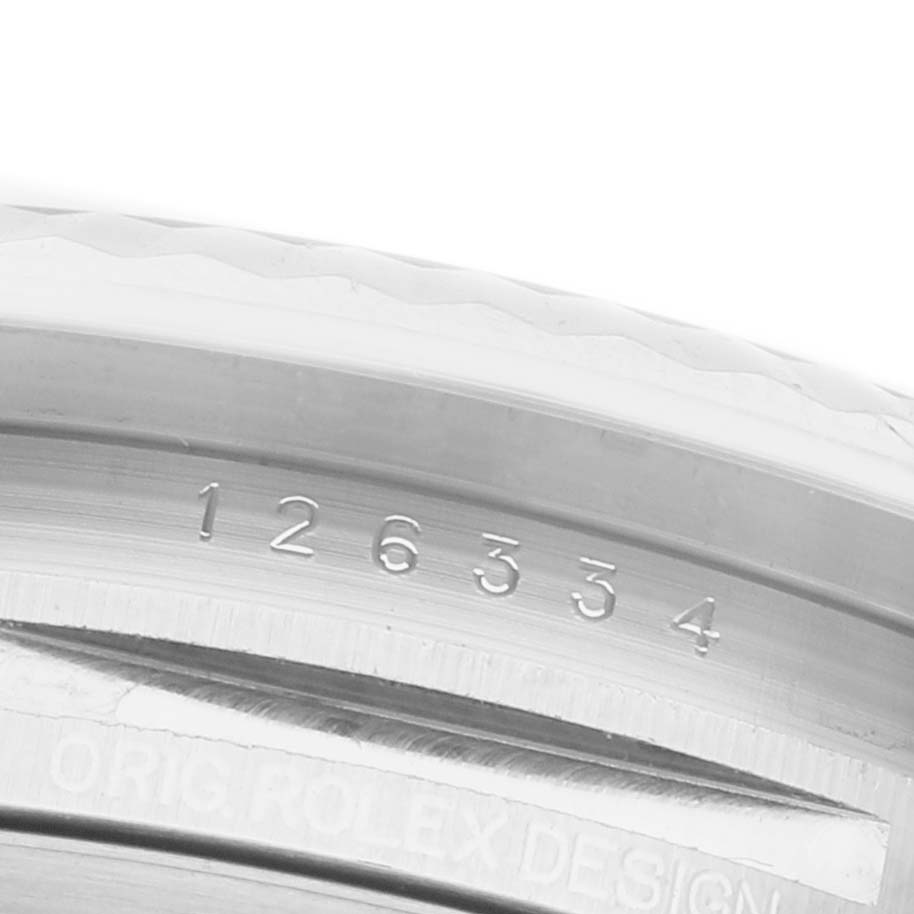 The image shows the side profile of a Rolex Datejust 41 126334 Men's Stainless Steel Grey Dial bezel, highlighting engraved detailing.