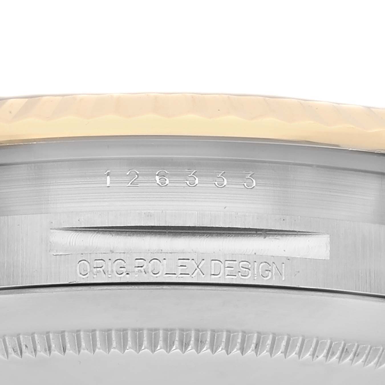 This image shows a close-up of the side of a Rolex Datejust 41 126333 Men's Steel and Gold (two tone) Grey Dial 126333 Men's Steel and Gold (two tone) Grey Dial, featuring the serial number and "ORIG. ROLEX DESIGN" engraving.