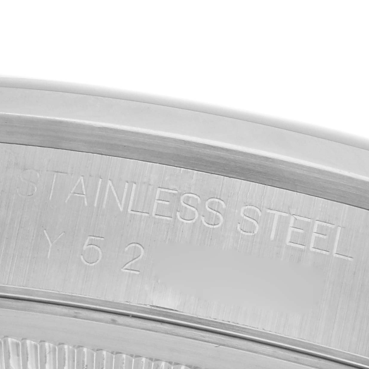 The image shows a close-up of the stainless steel case back edge of a Rolex Datejust 16200 Men
s Stainless Steel Blue Dial 16200 Men
s Stainless Steel Blue Dial watch.