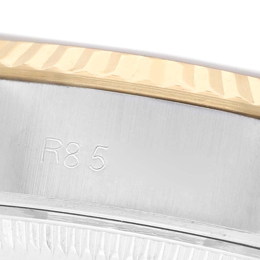 The image shows a close-up of the bezel and serial number area of a Rolex Datejust 69173 Women's Stainless Steel Champagne Dial watch.