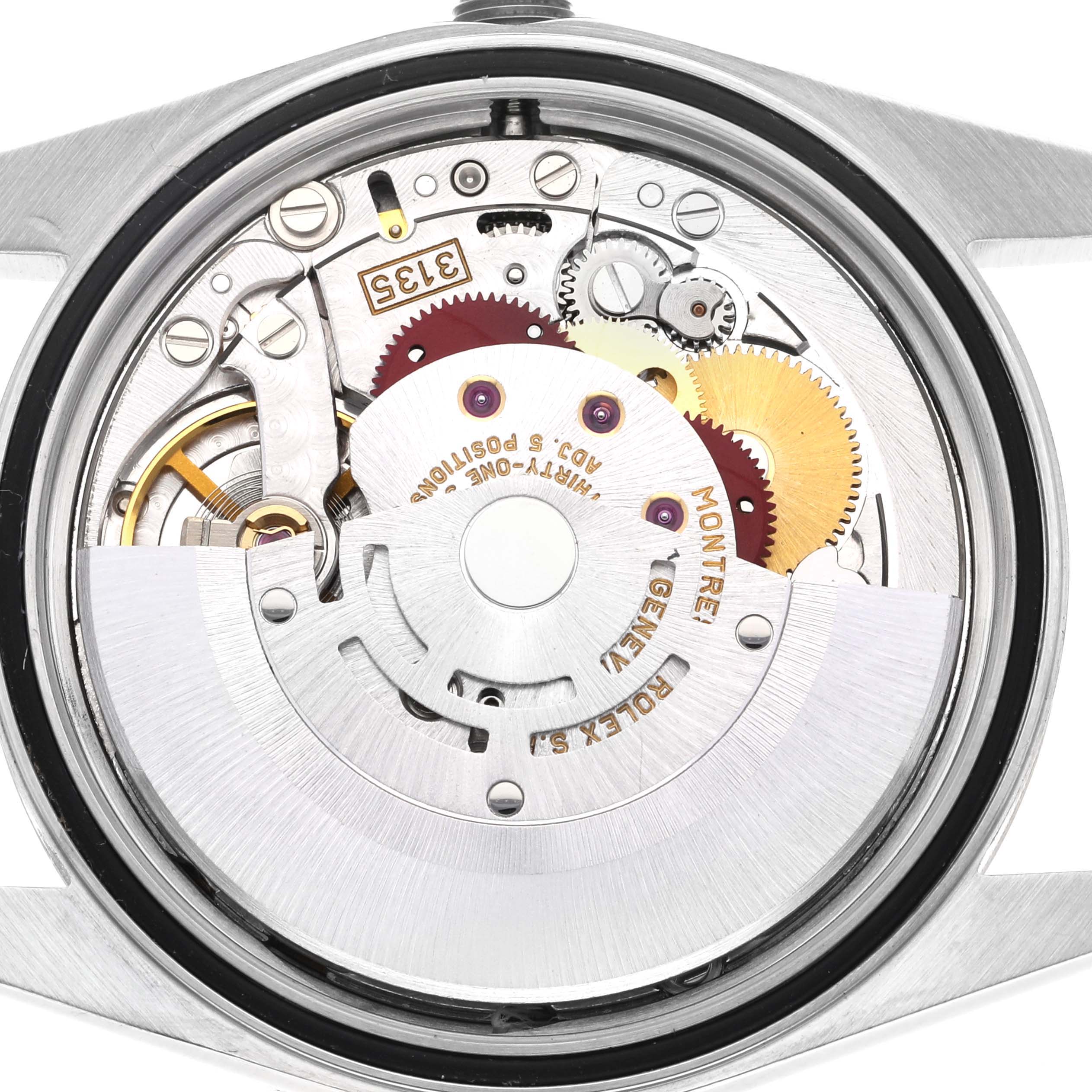 This image shows the internal mechanism of a Rolex Datejust 16233 Men's Steel and Gold (two tone) Champagne Dial 16233 Men's Steel and Gold (two tone) Champagne Dial watch from a back angle, revealing gears and the movement components.
