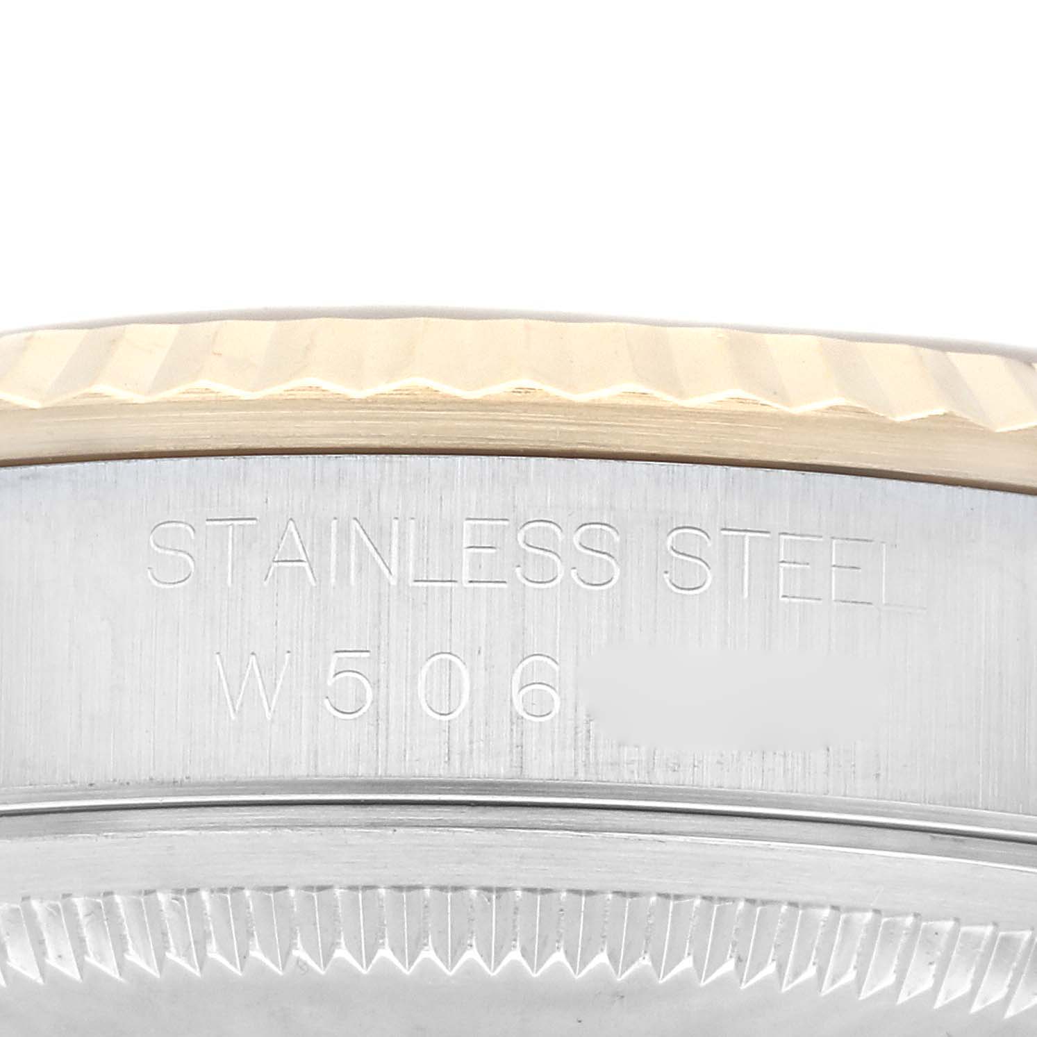 The image shows a close-up of the side of a Rolex Datejust 16233 Men's Steel and Gold (two tone) Champagne Dial 16233 Men's Steel and Gold (two tone) Champagne Dial watch, highlighting the stainless steel case and the fluted bezel.