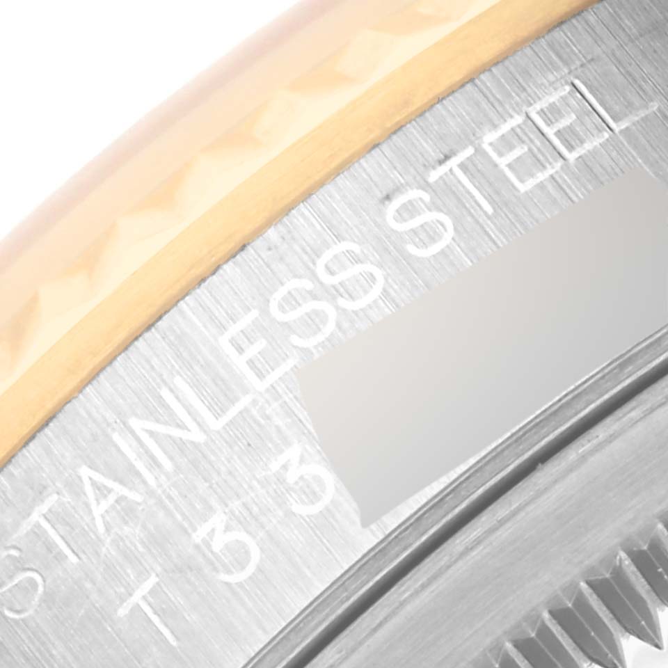 The image shows a close-up of the case back edge of a Rolex Datejust 16233 Men's Stainless Steel Champagne Dial 16233 Men's Stainless Steel Champagne Dial, highlighting "STAINLESS STEEL."