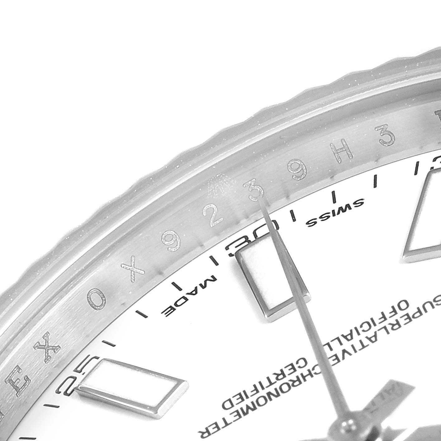 This close-up image of the Rolex Datejust 41 116334 Men
s Stainless Steel White Dial 116334 Men
s Stainless Steel White Dial model shows the dial, bezel, and part of the hands.