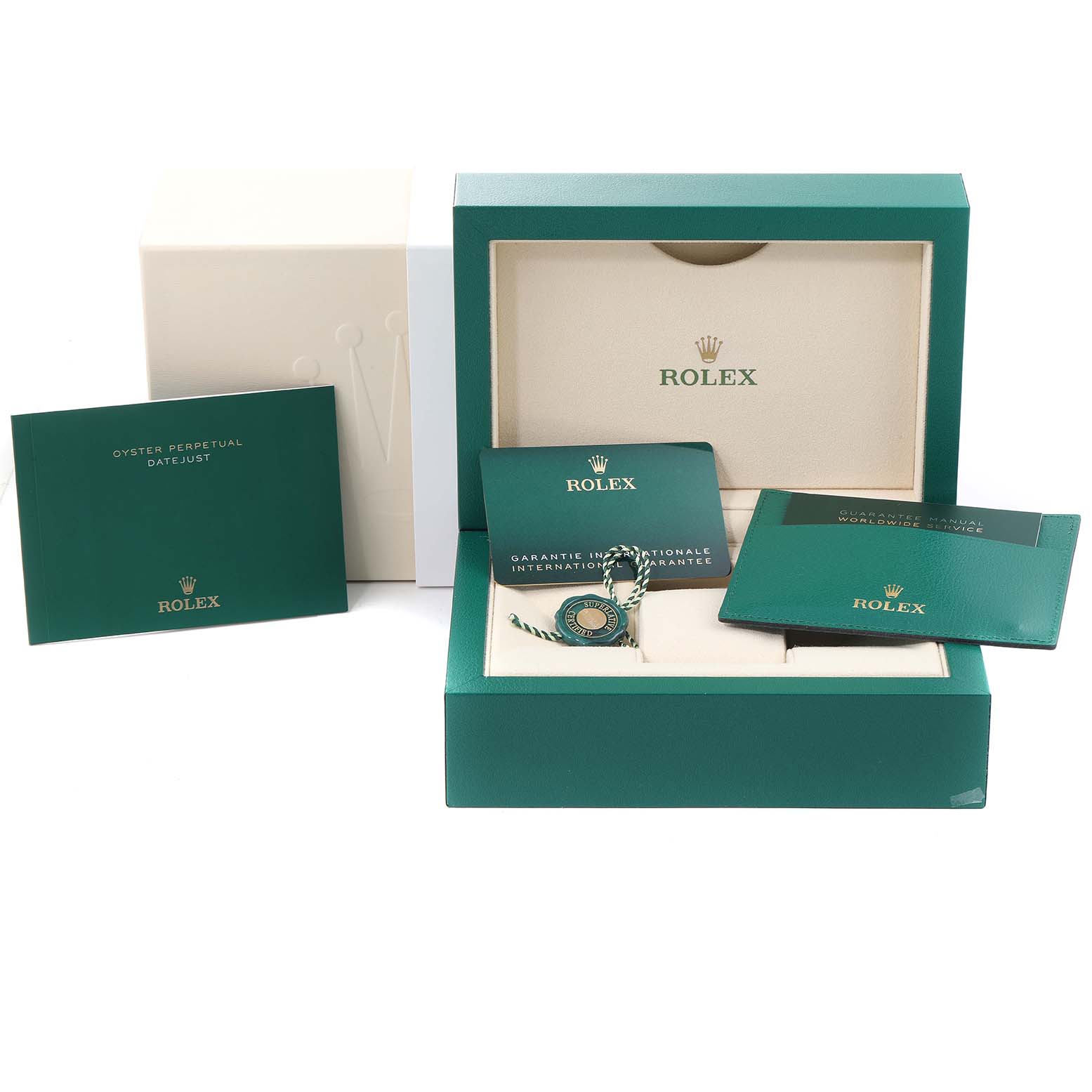 The image shows the packaging, manuals, and guarantee card for a mid-size Rolex Oyster Perpetual Datejust watch.