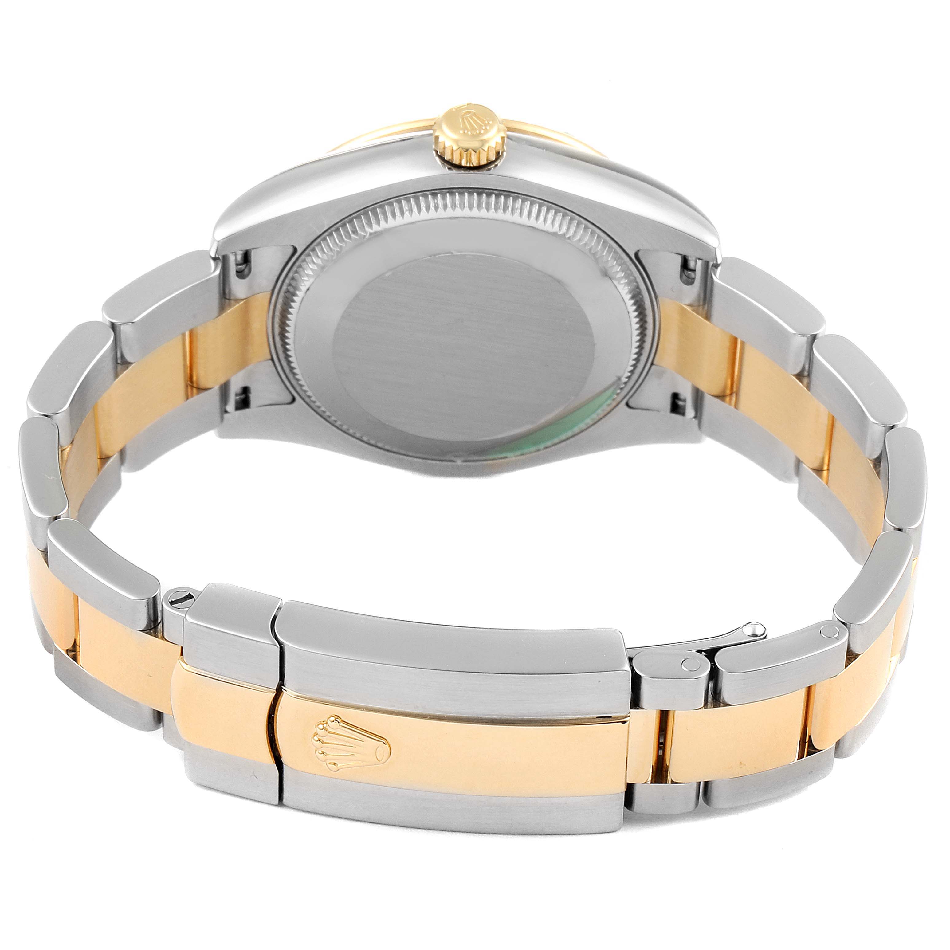 The image shows the back view of a Mid-Size Rolex watch, highlighting its two-tone bracelet and clasp.