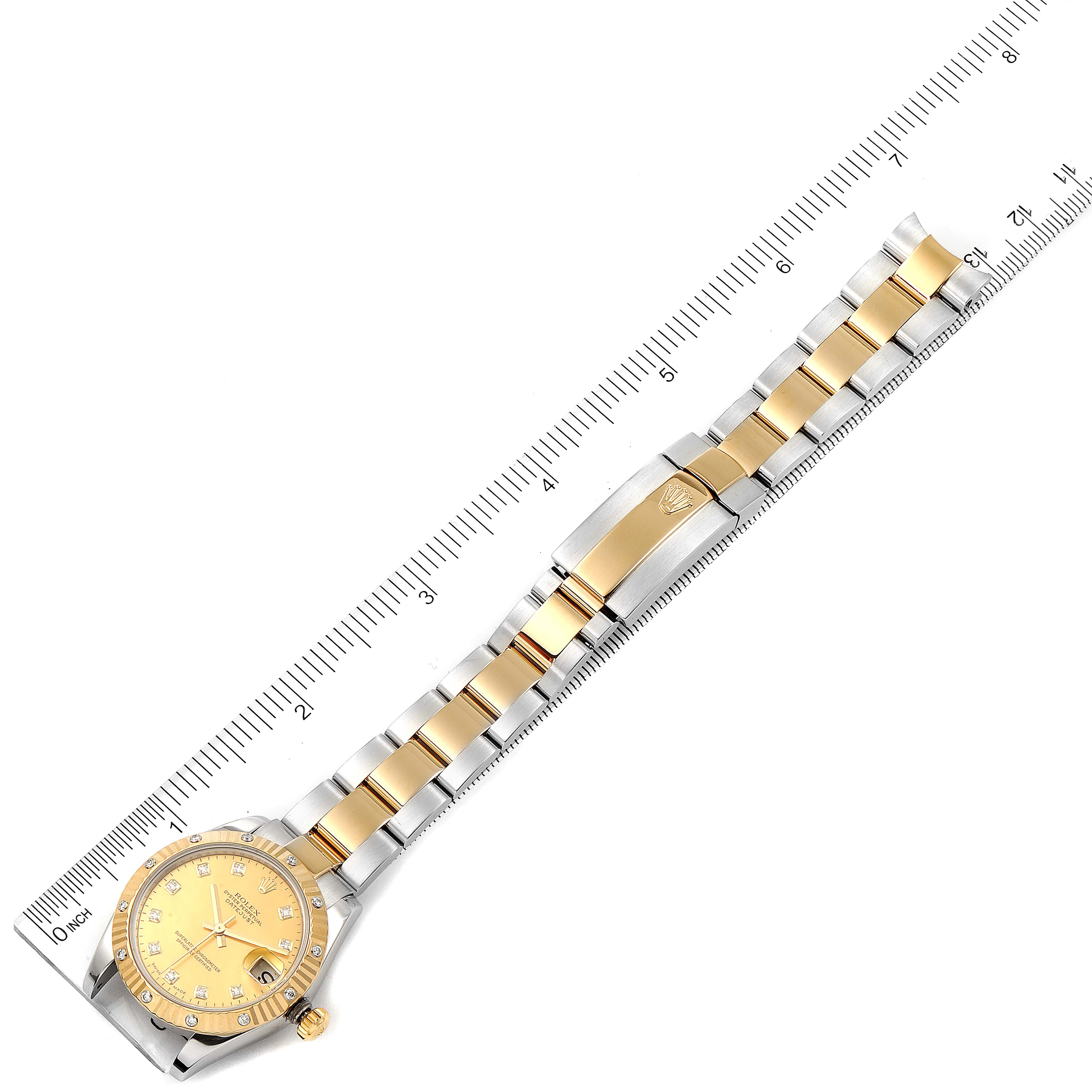 The image depicts a Rolex Mid-Size 178313 Women's Steel and Gold (two tone) Mother of Pearl Dial 178313 Women's Steel and Gold (two tone) Mother of Pearl Dial model watch, shown from a top-down angle, including the entire face, bracelet, and clasp.