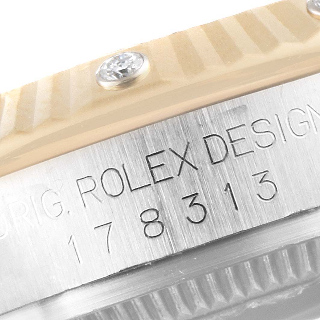This image shows a close-up of the side engraving and part of the bezel of a Mid-Size Rolex watch, model number 178313.
