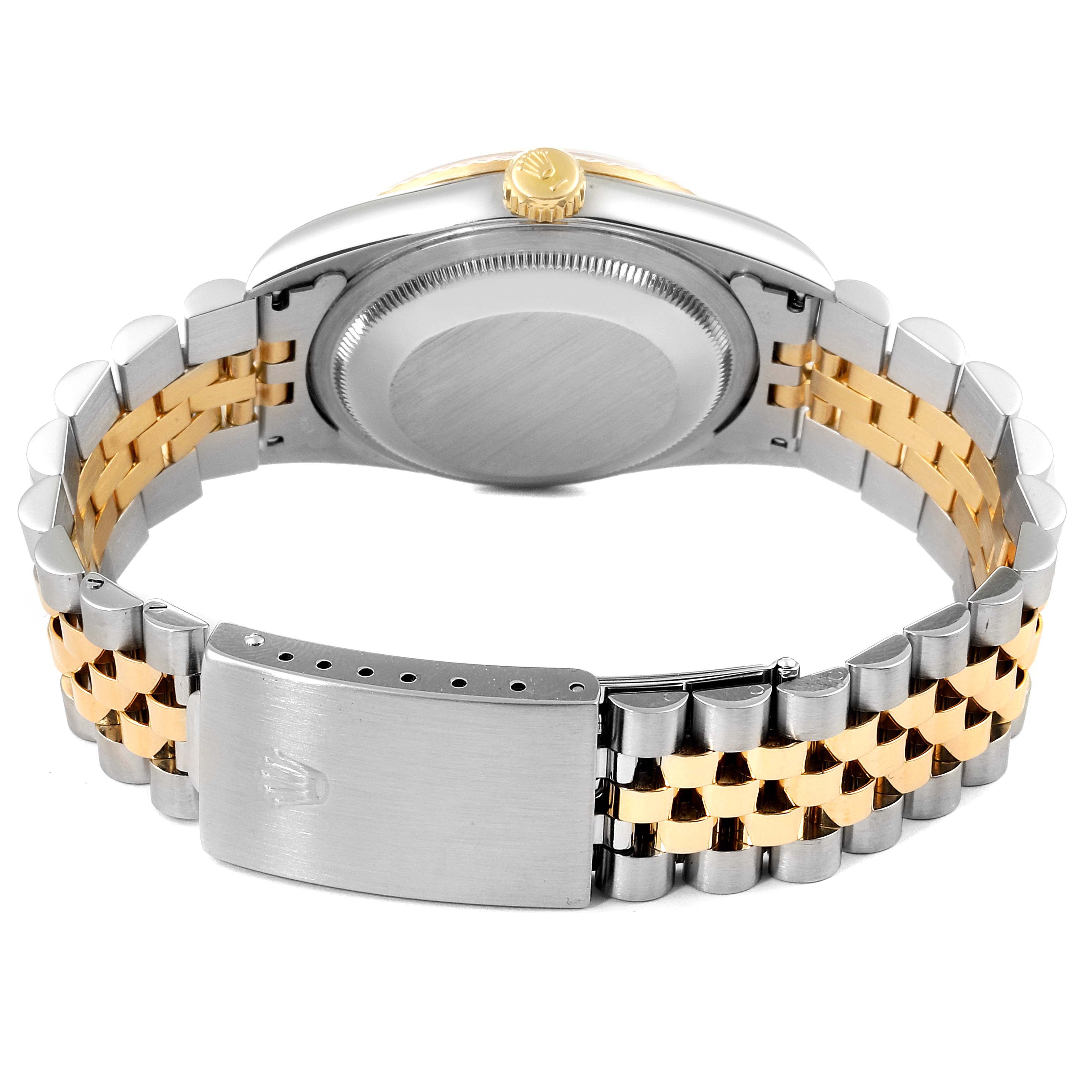 This image shows the back and clasp of a Rolex Datejust 16233 Men
s Steel and Gold (two tone) Grey Dial 16233 Men
s Steel and Gold (two tone) Grey Dial watch with a two-tone metal bracelet, viewed from the rear.