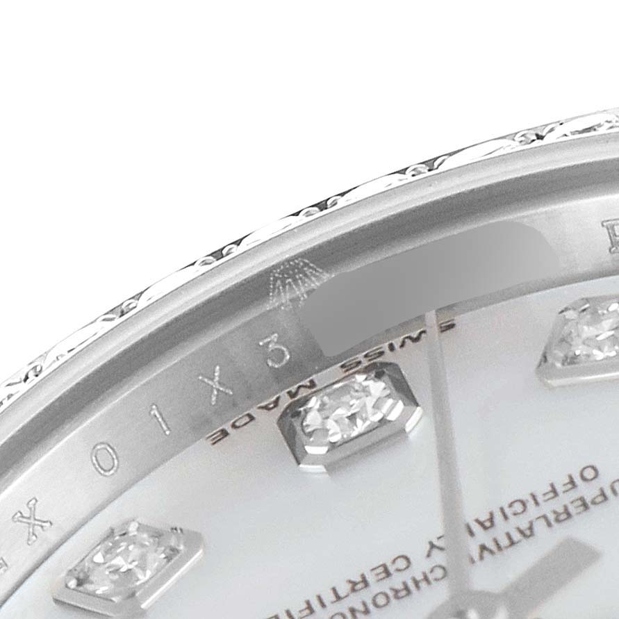 This image shows a close-up of the dial and bezel of a Rolex Datejust 179384 Women's Stainless Steel Mother of Pearl Dial 179384 Women's Stainless Steel Mother of Pearl Dial watch, highlighting the diamond hour markers and part of the engraved details.